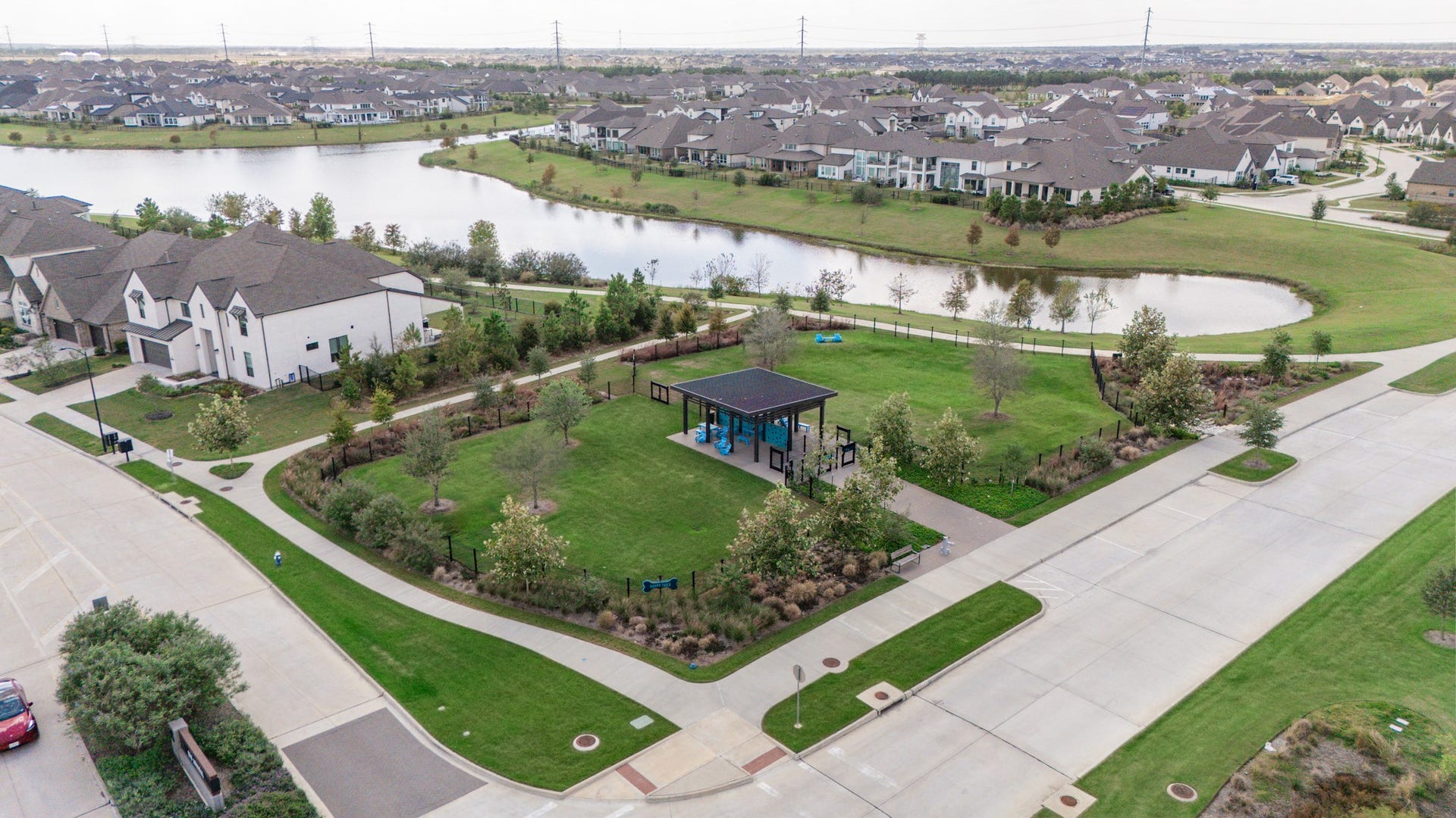 Charming community with picturesque lake views, lush green spaces, and modern amenities, perfect for living and outdoor enjoyment.