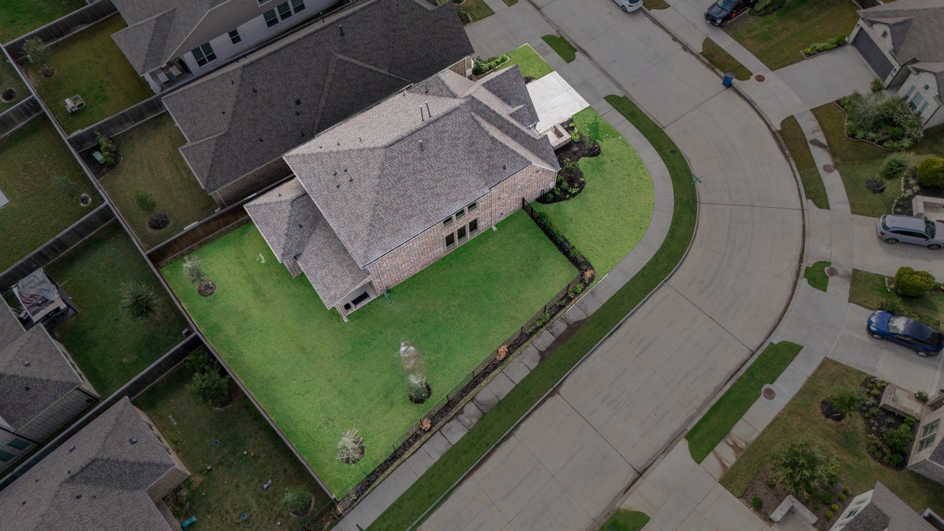 Spacious corner-lot home with a large, well-maintained backyard, perfect for outdoor activities and potential landscaping.