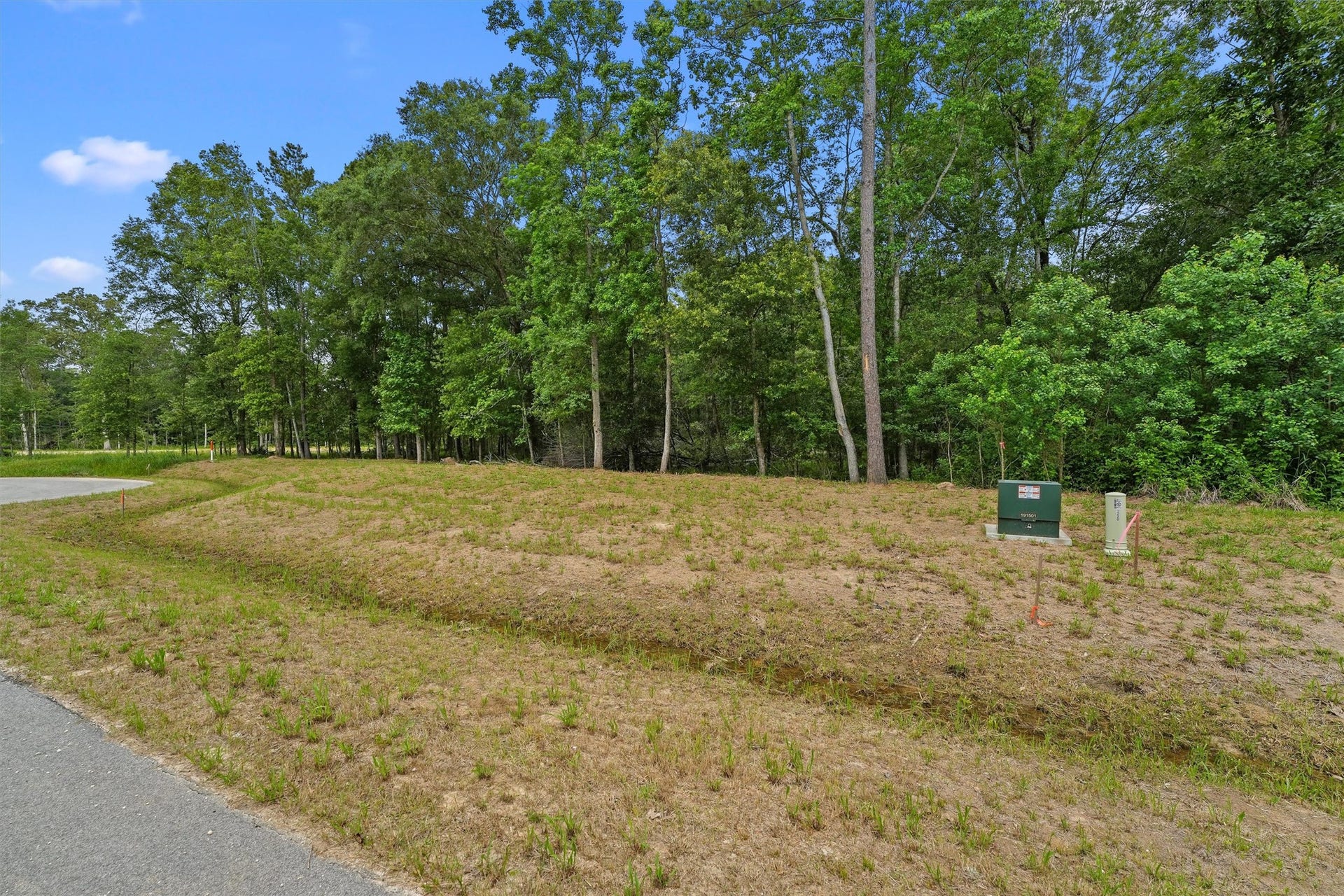1230 Road 6324, Dayton, TX 77535 Street-level view of the homesite frontage. Buyers should independently verify utility availability, connection requirements and building specifications.