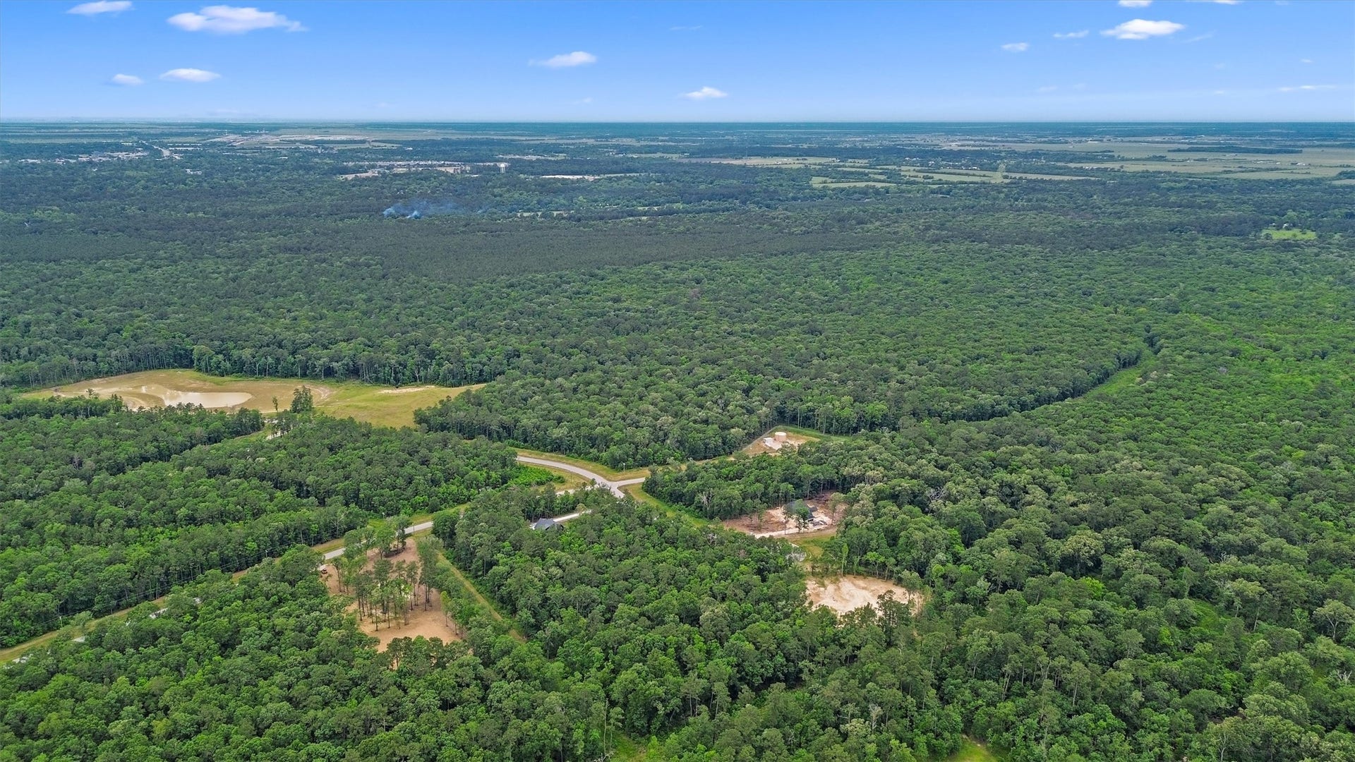 1230 Road 6324, Dayton, TX 77535 A bird's-eye perspective showcases the low-density, wooded character surrounding White Oak Trails in Liberty County.