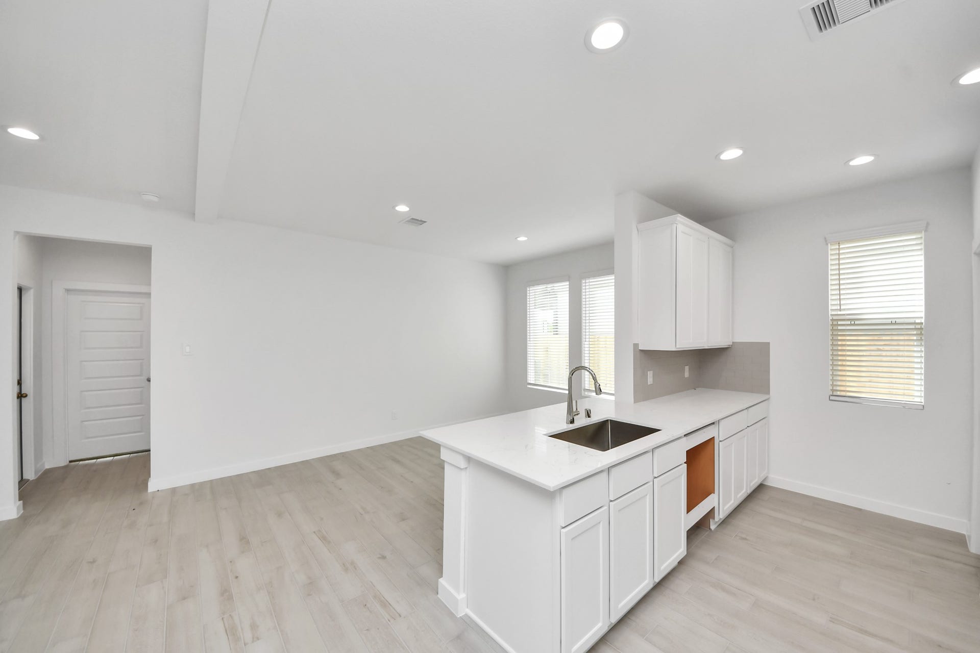 15947 Sycamore Maple Lane, Cypress, TX 77429 The open concept effortlessly connects the kitchen to the expansive family room, forming a perfect hub for gatherings. This seamless flow creates an inviting space where cooking and socializing come together harmoniously.