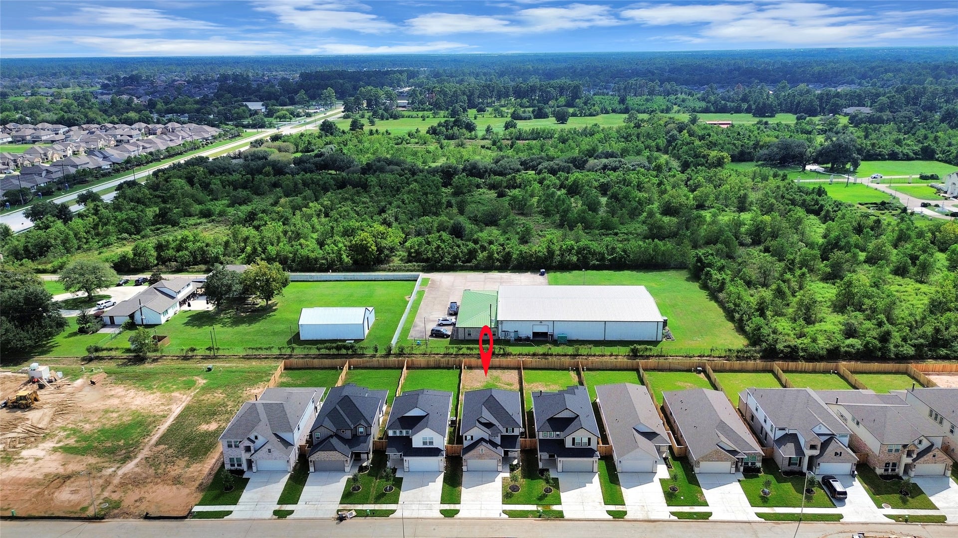 15947 Sycamore Maple Lane, Cypress, TX 77429 An aerial view of a spacious subdivision lot, highlighting a well-maintained yard and a fully fenced perimeter, offering both privacy and expansive outdoor space.