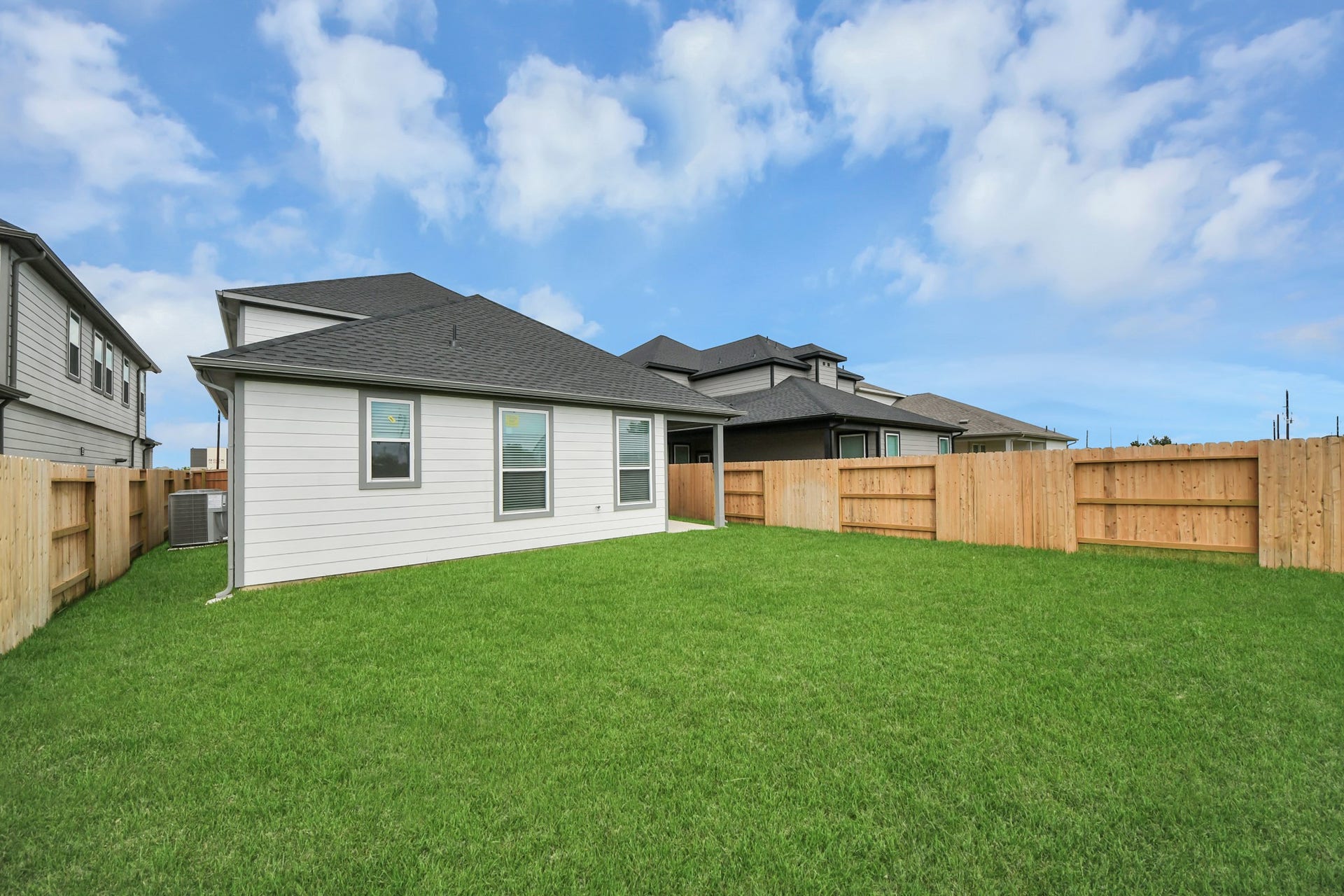 15947 Sycamore Maple Lane, Cypress, TX 77429 Backyard retreat, offering an abundance of space for kids to play and explore. The possibilities are endless in this outdoor haven, where the joy of open-air activities and family gatherings awaits.