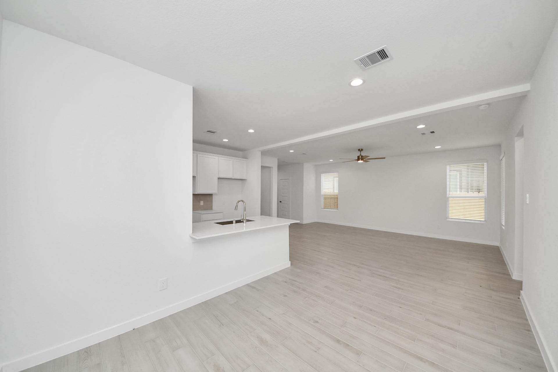 15947 Sycamore Maple Lane, Cypress, TX 77429 Create lasting memories with your family and friends at the dining table! This expansive dining room showcases sophisticated flooring, custom paint, and seamlessly connects to the family room and kitchen, providing an open and inviting atmosphere
