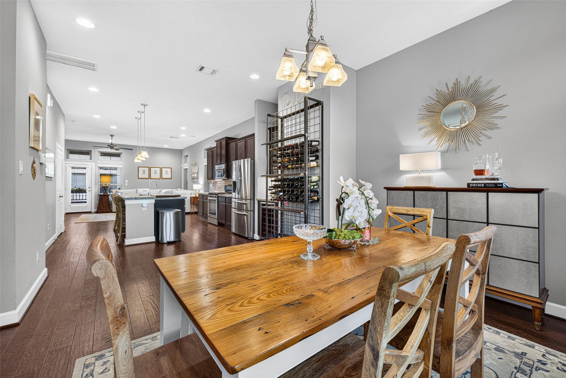2602 Ashland Street, Houston, TX 77008 Dining area with hardwood floors and elegant lighting, seamlessly connecting to the open-concept kitchen and living space.