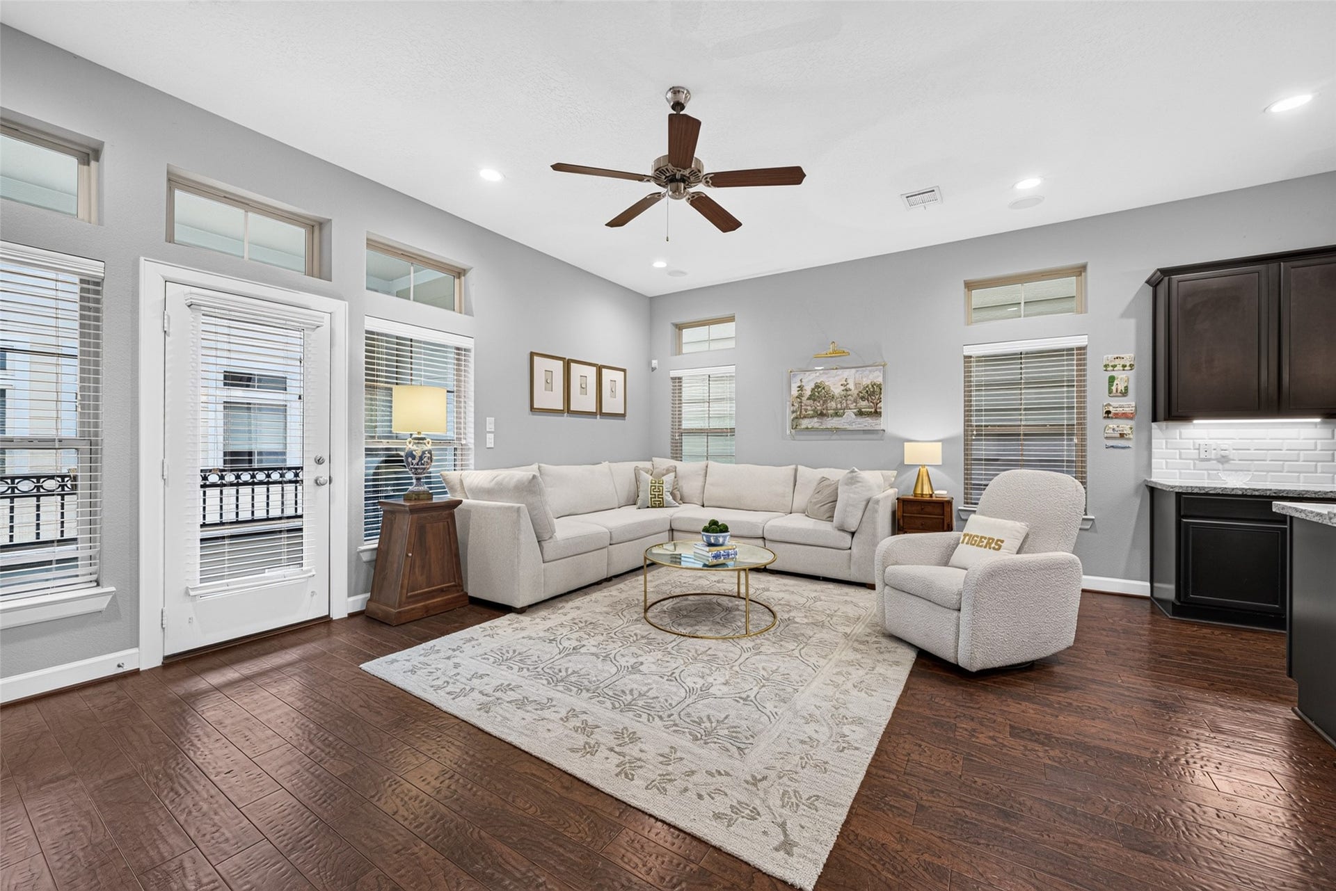 2602 Ashland Street, Houston, TX 77008 Bright, inviting living room with hardwood floors, recessed lighting, and French doors leading outdoors.