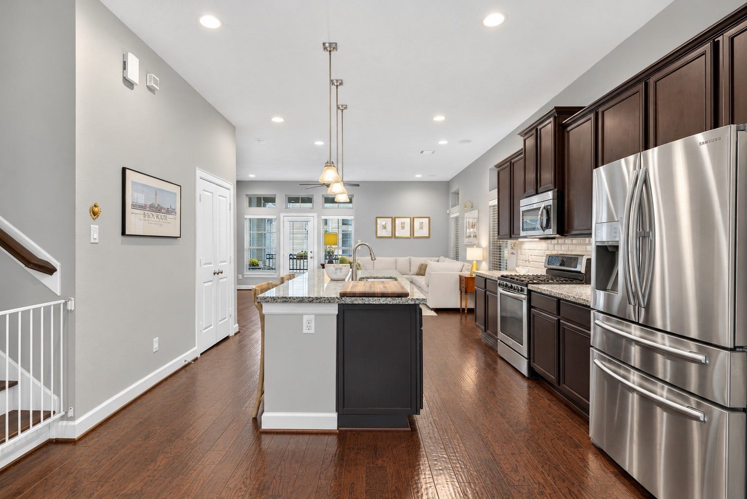 2602 Ashland Street, Houston, TX 77008 Another perspective highlights the kitchen's ample cabinetry, counter space, and stainless steel refrigerator.