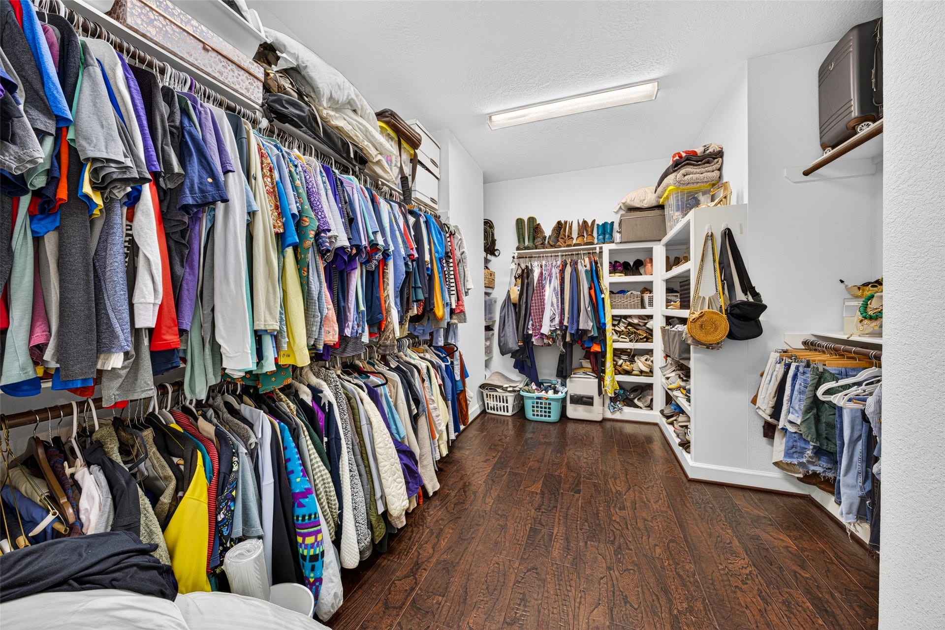 2602 Ashland Street, Houston, TX 77008 Primary Walk-in closet with ample built-in shelving and hanging space for organized storage.
