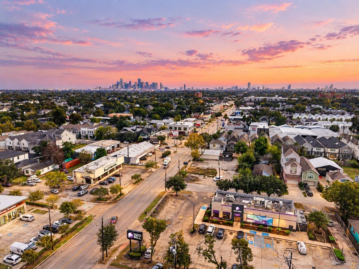 2602 Ashland Street, Houston, TX 77008 Beautiful aerial view showcasing the surrounding neighborhood, nearby dining and shopping, and the Houston skyline in the distance.