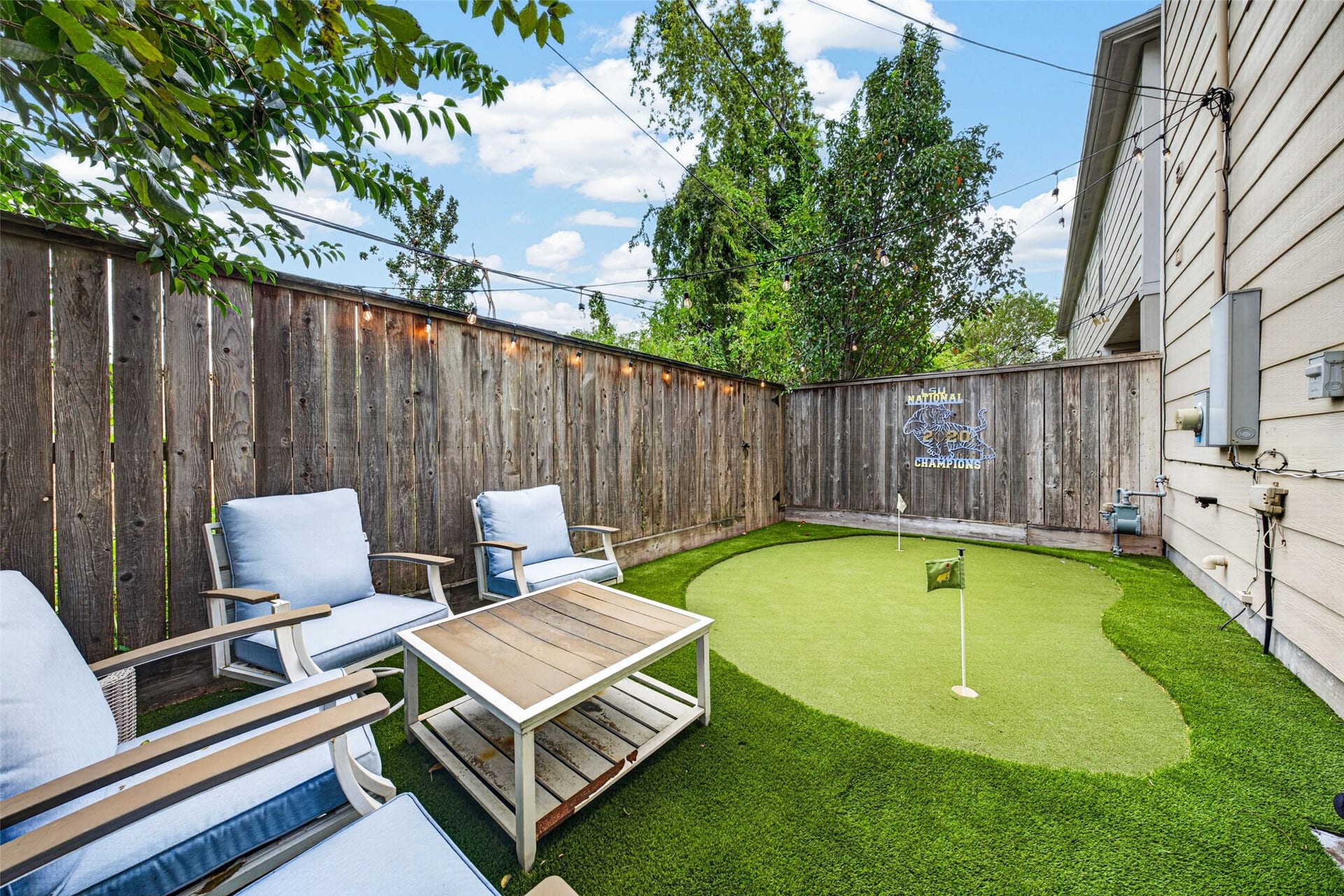 2602 Ashland Street, Houston, TX 77008 Low-maintenance backyard with artificial turf, outdoor seating, and a private putting greenperfect for relaxing or practicing your short game.