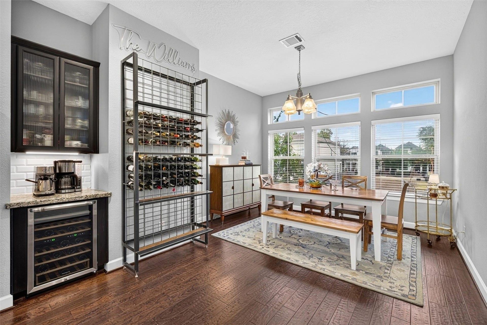2602 Ashland Street, Houston, TX 77008 Dining space features large windows, built-in cabinetry, and wine storage for entertaining.
