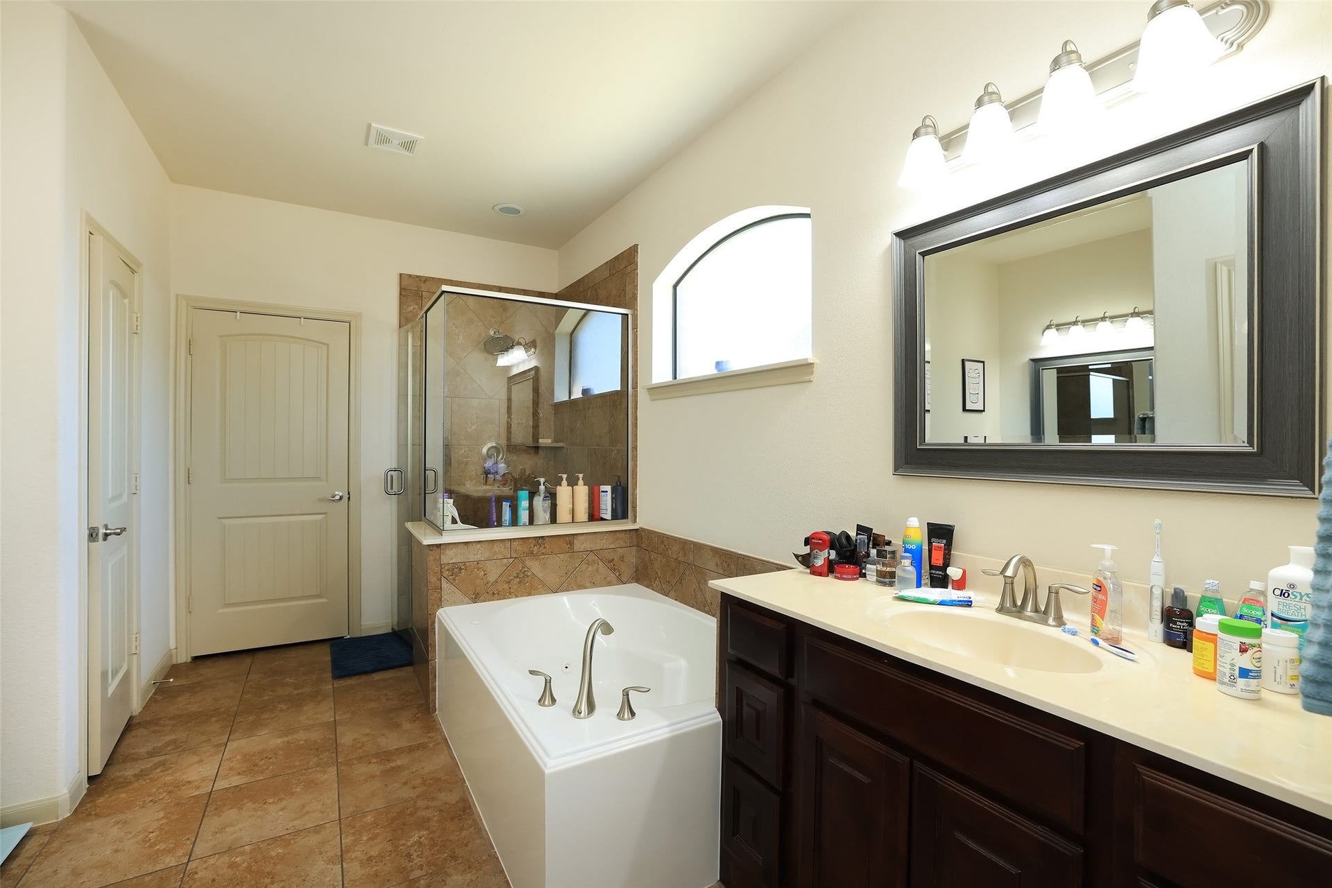 Lots of space in the master bathroom with separate jacuzzi tub and shower