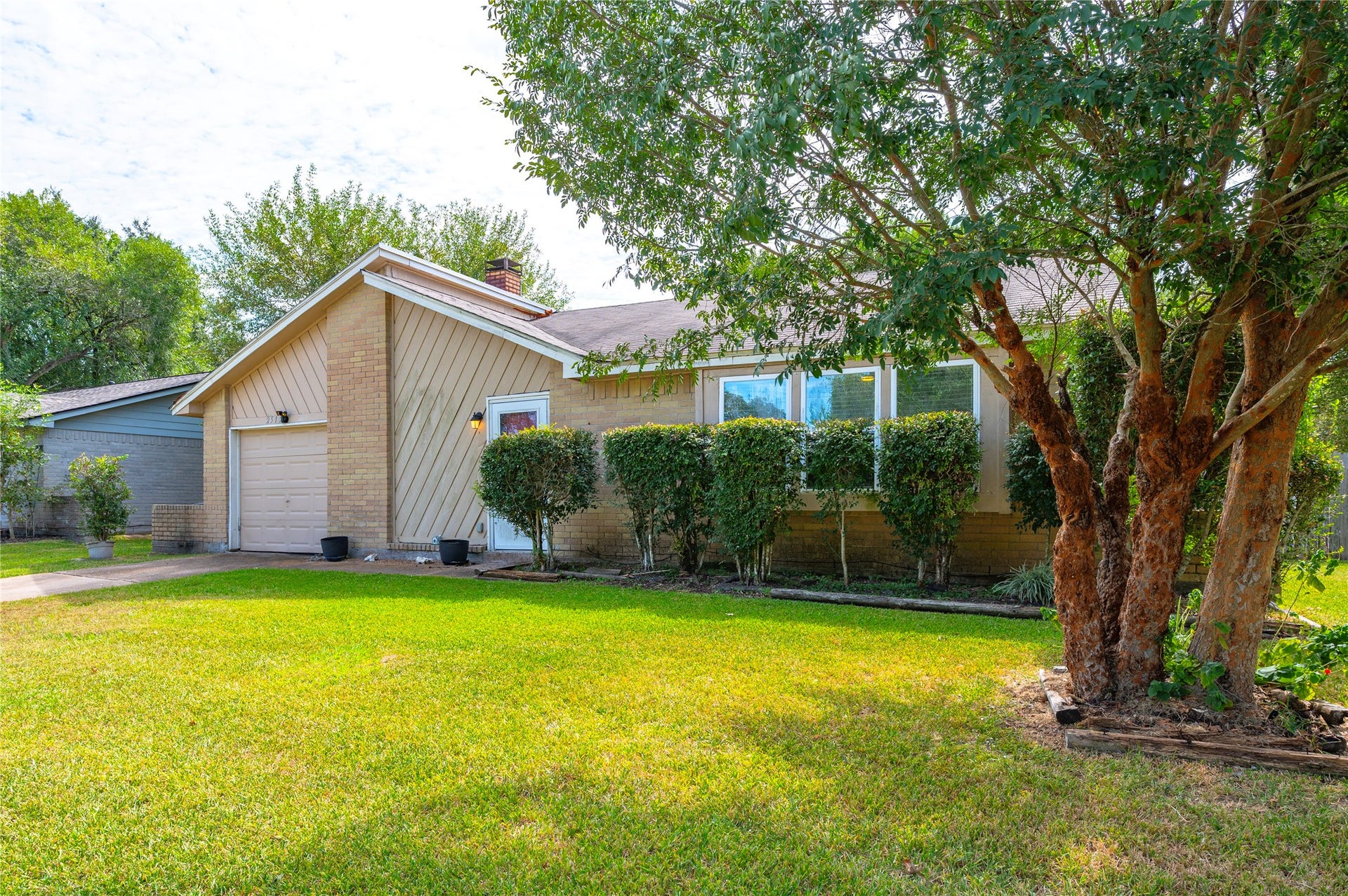 2515 Knoxville Drive, League City, TX 77573 Tree and landscaping give the home curb appeal.