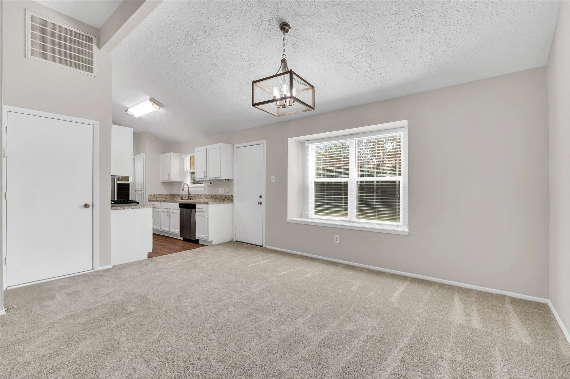 2515 Knoxville Drive, League City, TX 77573 Dining area with backyard views, open to kitchen and living room.