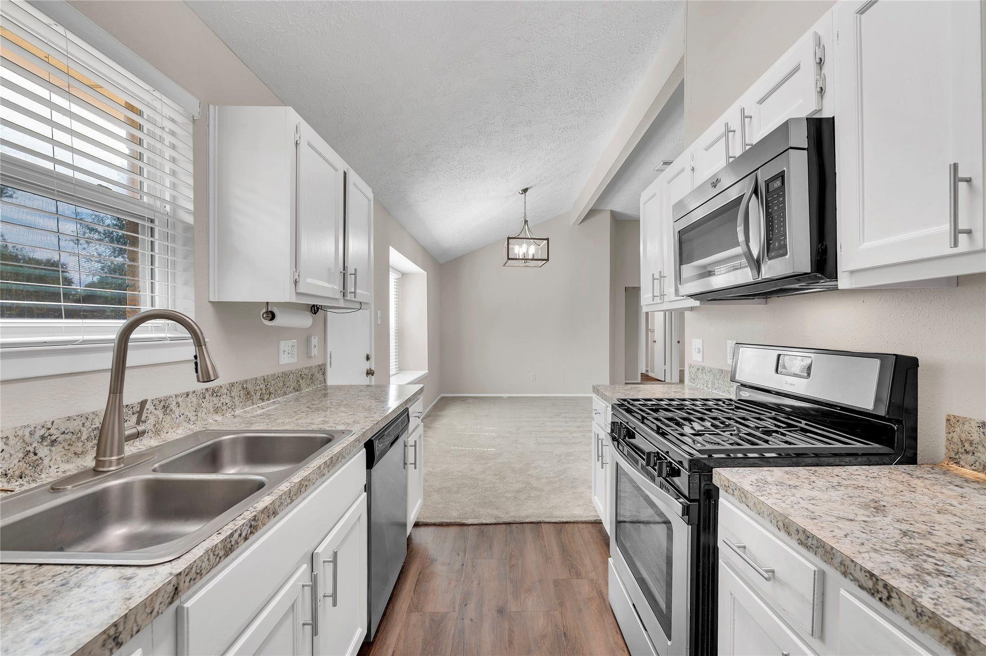 2515 Knoxville Drive, League City, TX 77573 Stainless steel gas range and built in overhead microwave..