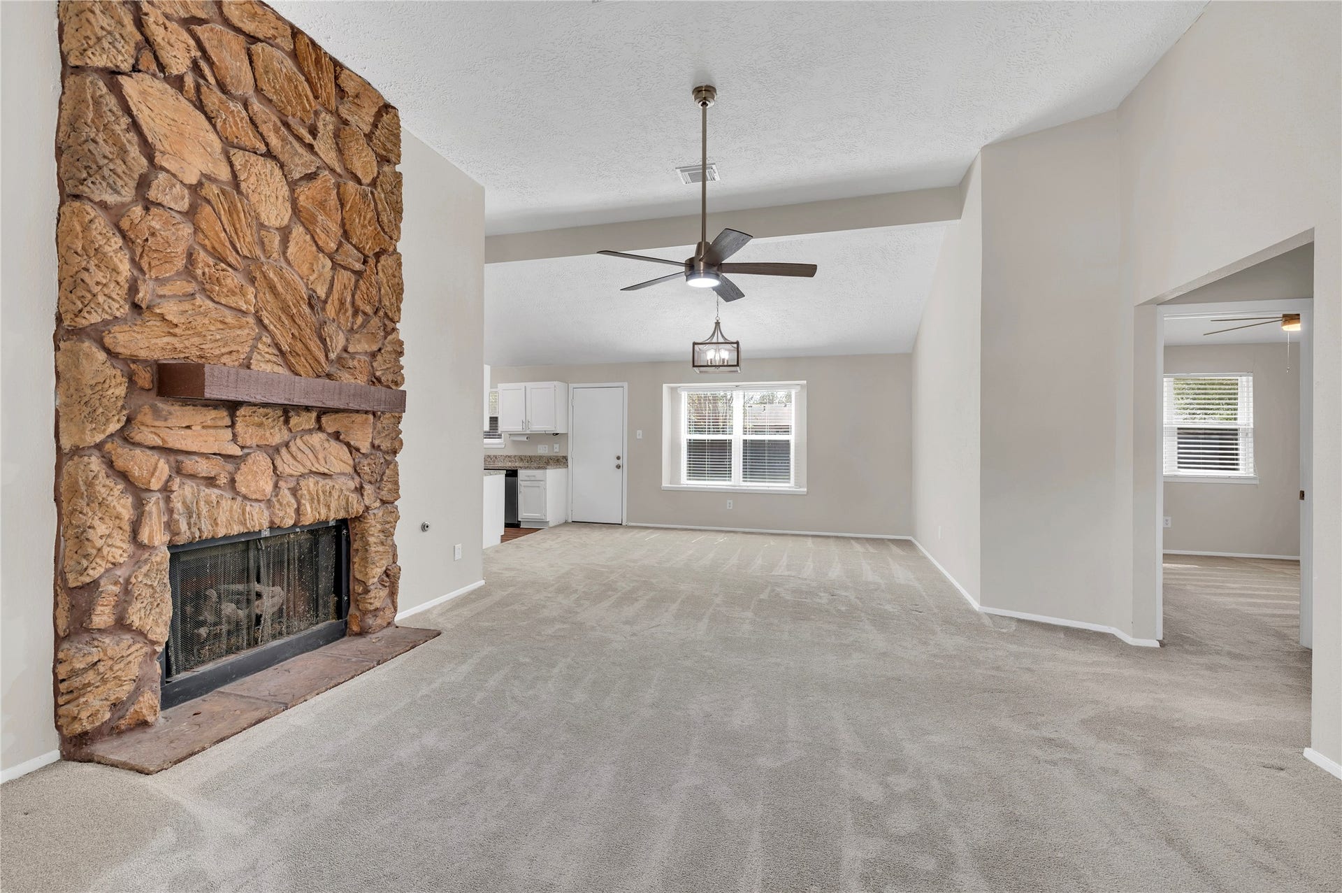 2515 Knoxville Drive, League City, TX 77573 Large living room with stone fireplace.