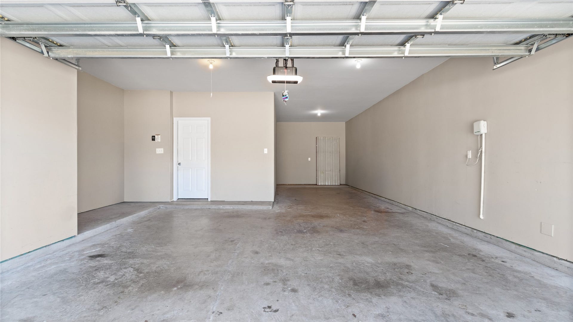 12106 Obsidian Lane, Mont Belvieu, TX 77535 This three-car tandem garage offers ample space for vehicles, recreational equipment, and extra storage. The home features a recently installed sprinkler system with the control unit conveniently located on the garage wall.
