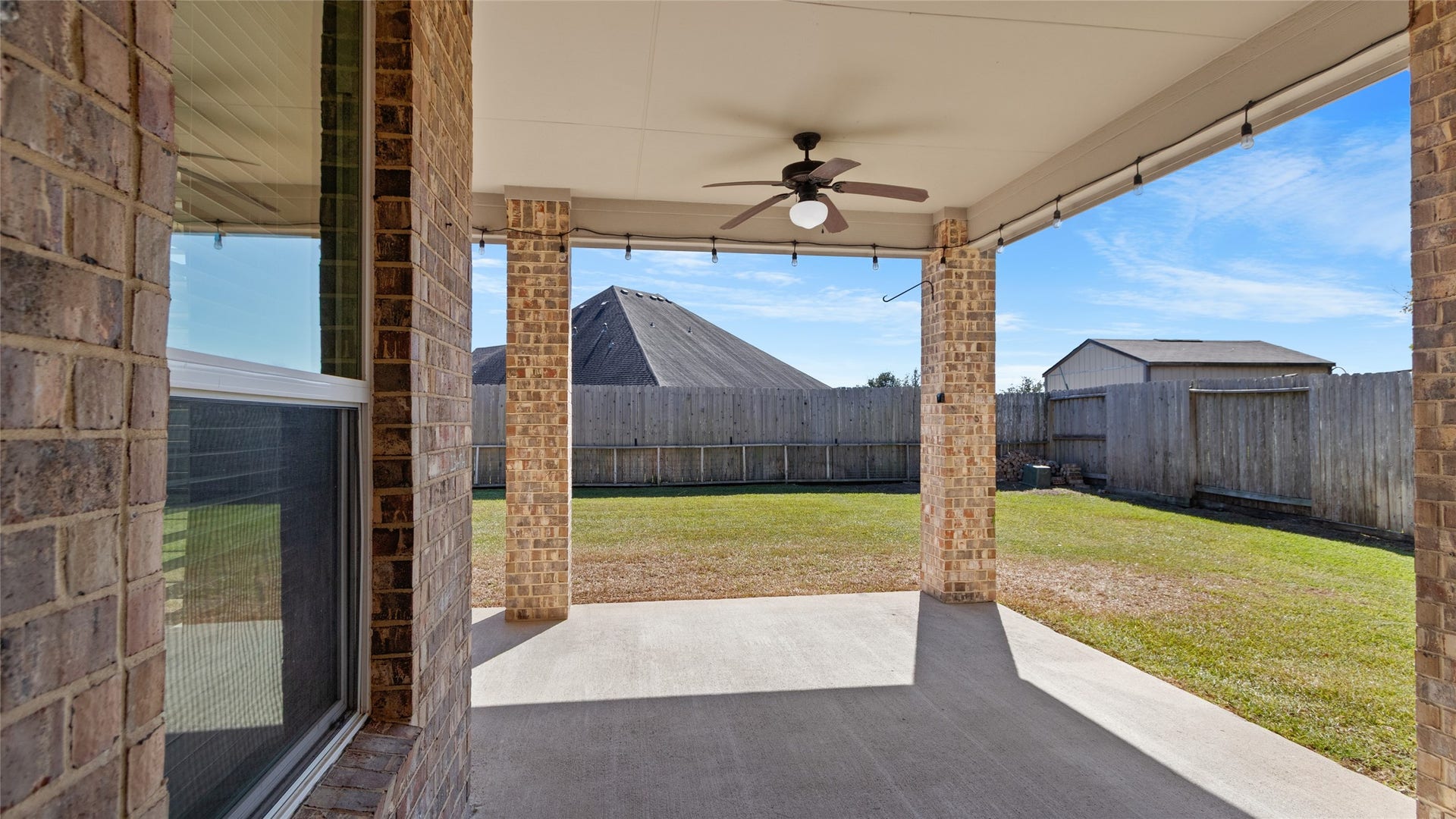 12106 Obsidian Lane, Mont Belvieu, TX 77535 Exit out into this beautiful large brick patio space just perfect for family and friends to gather!