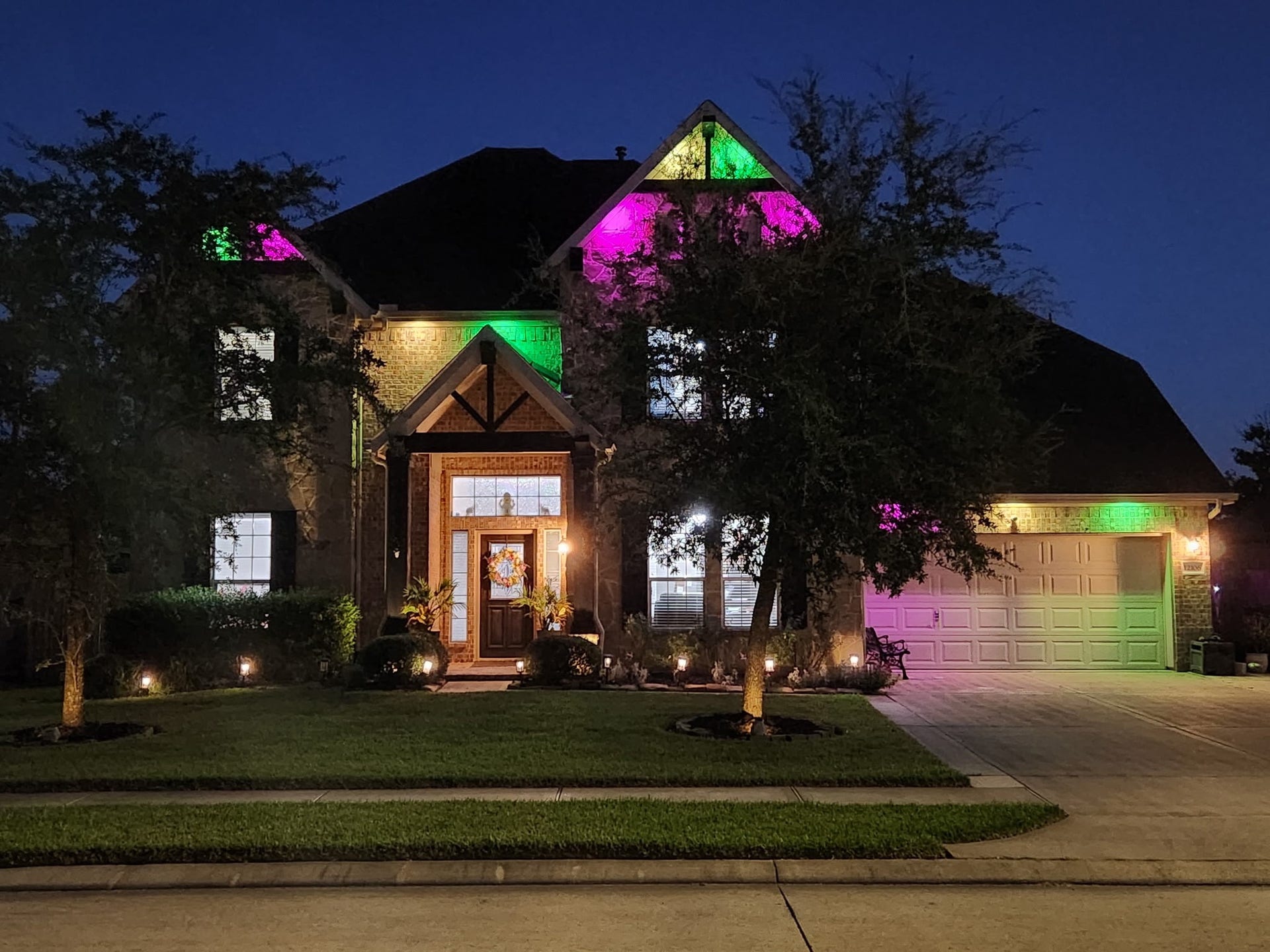 12106 Obsidian Lane, Mont Belvieu, TX 77535 A twilight view of the home that has year round lights installed that operate from an App. The color schemes are endless!