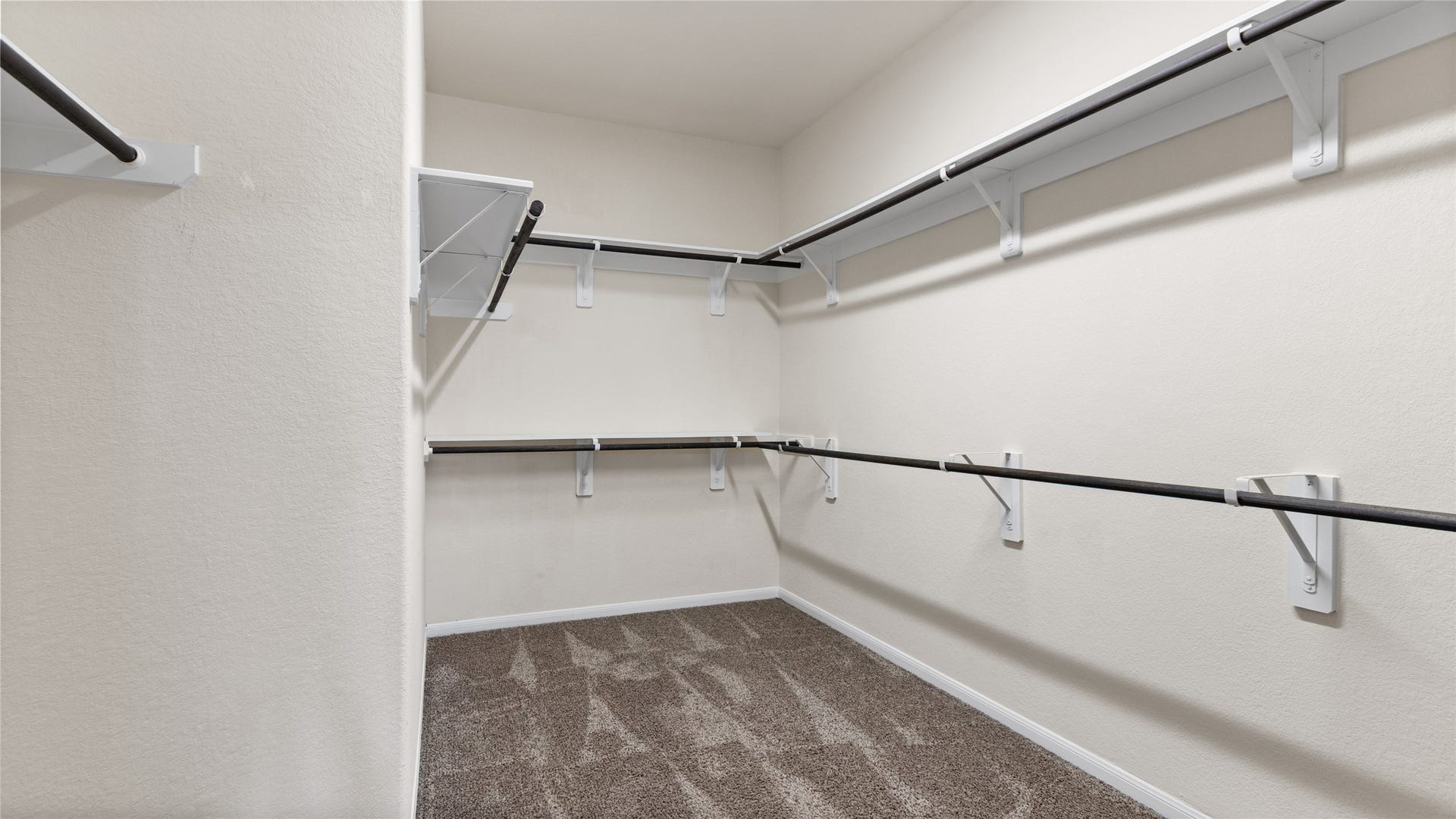 12106 Obsidian Lane, Mont Belvieu, TX 77535 This picture doesn't show the entire primary closet but this space is quite large.