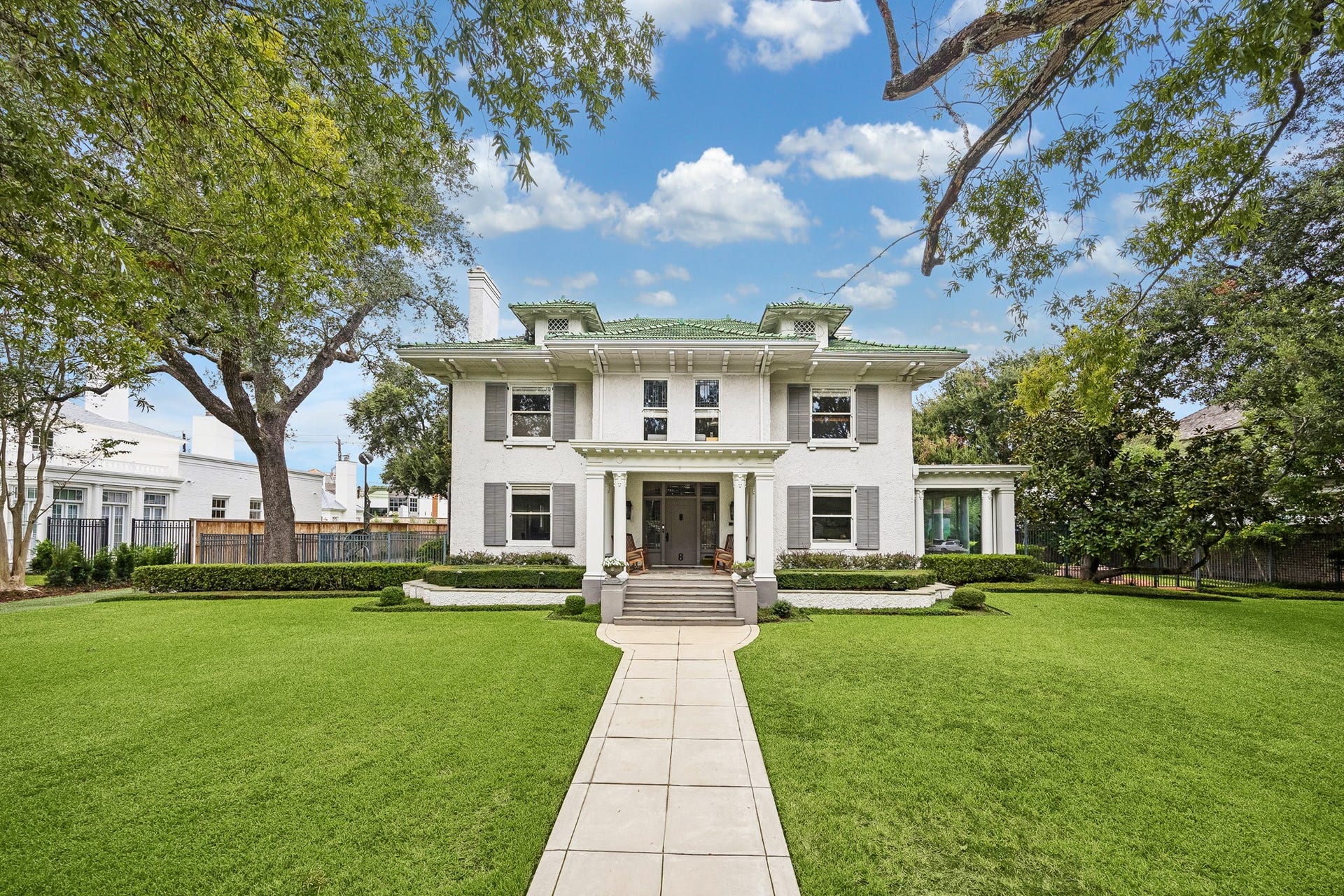 8 Courtlandt Place, Houston, TX 77006 One final look at this remarkable residence, where the distinctive green tile roof, classic symmetry and beautifully maintained grounds reflect the timeless appeal of historic Courtlandt Place. A truly special place to call home.