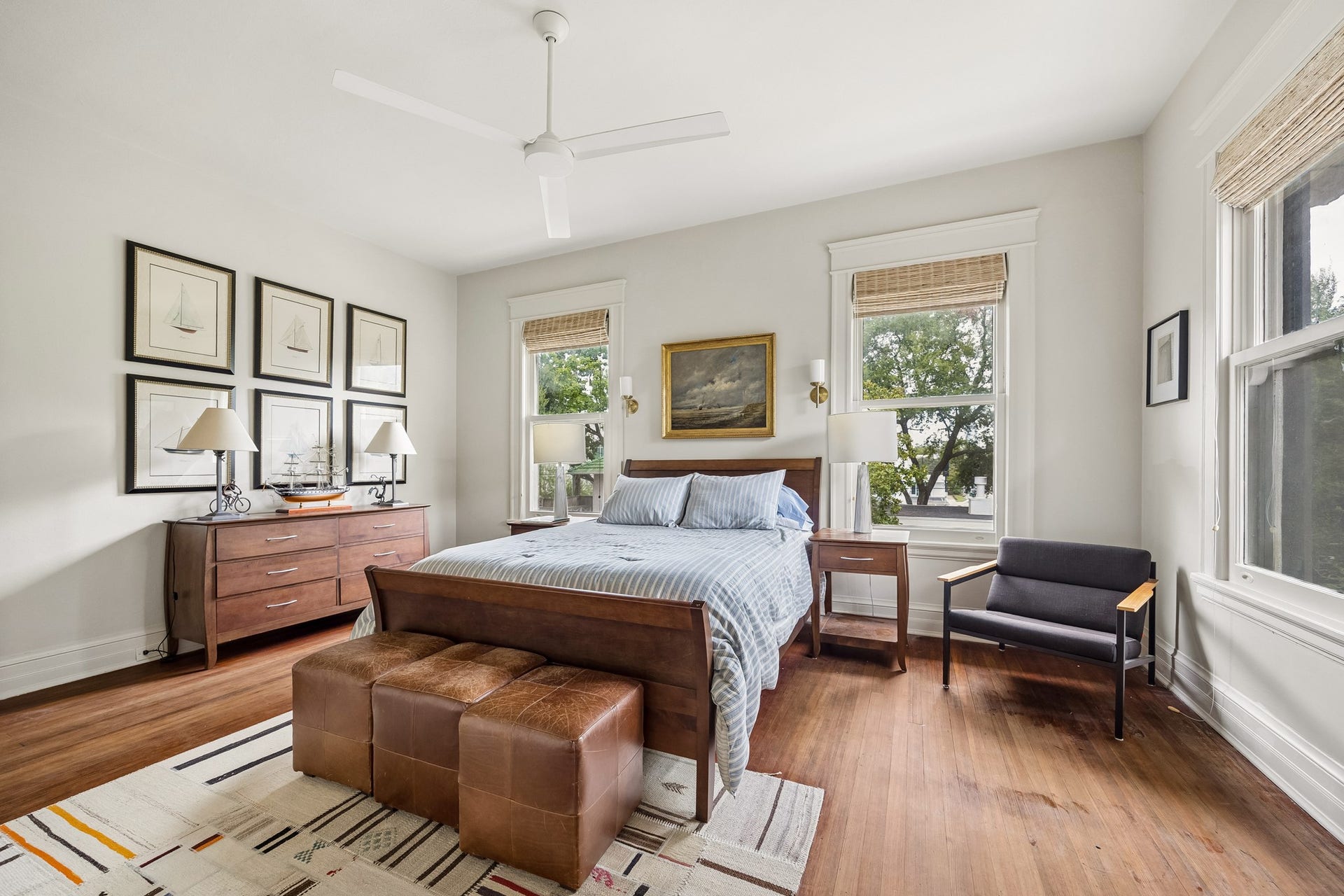 8 Courtlandt Place, Houston, TX 77006 Well-proportioned secondary bedroom with windows on two sides, offering pleasant neighborhood views and a bright, airy atmosphere.