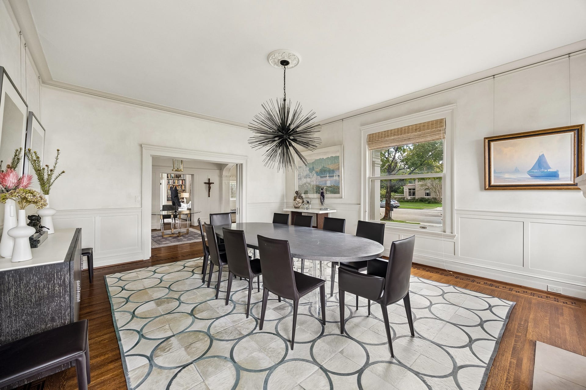 8 Courtlandt Place, Houston, TX 77006 An alternate view reveals beautifully detailed wall paneling, classic moldings and expansive windows overlooking the neighborhood.