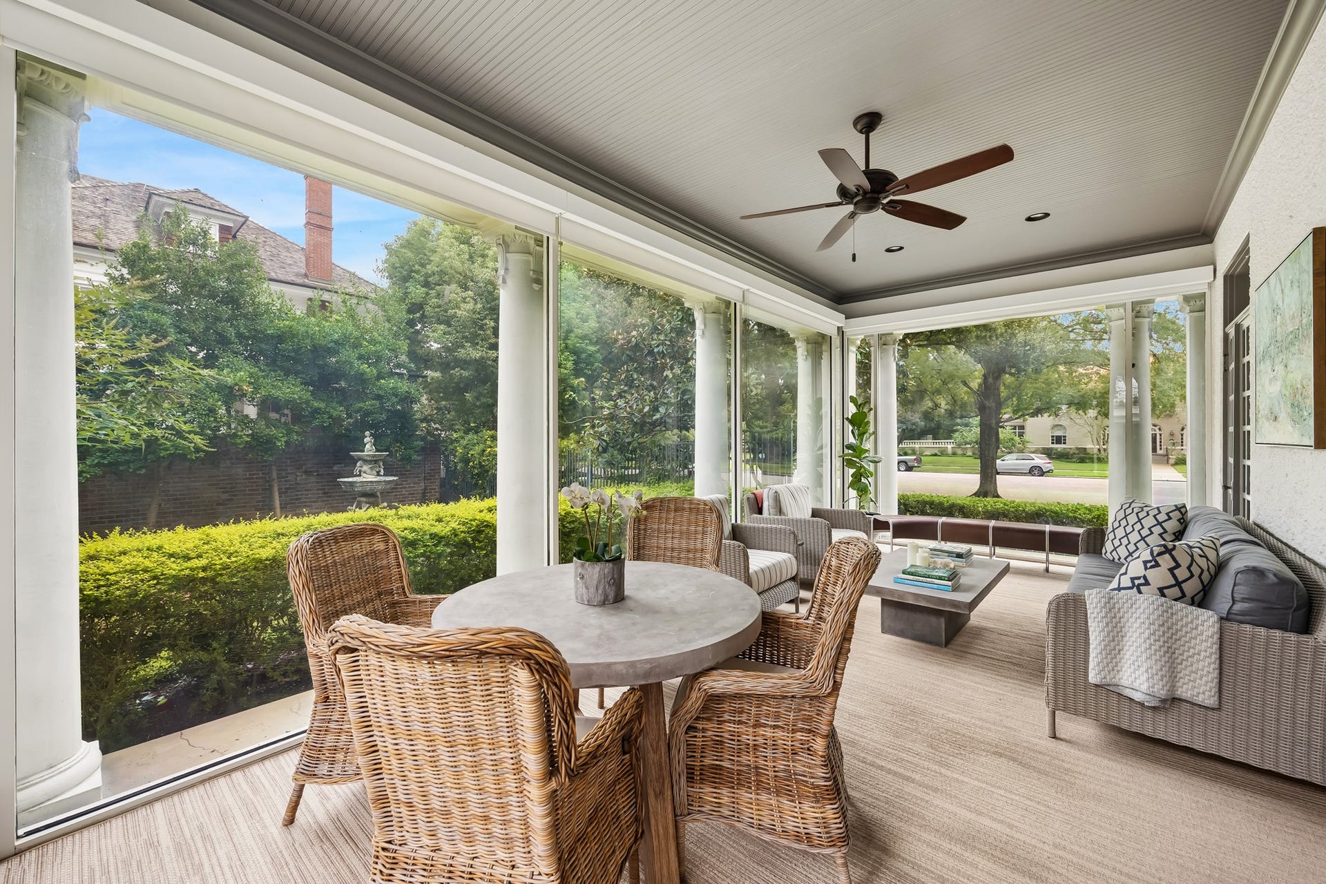 8 Courtlandt Place, Houston, TX 77006 A delightful sunroom surrounded by expansive windows offers peaceful garden views and a wonderful setting for relaxing or casual gatherings.