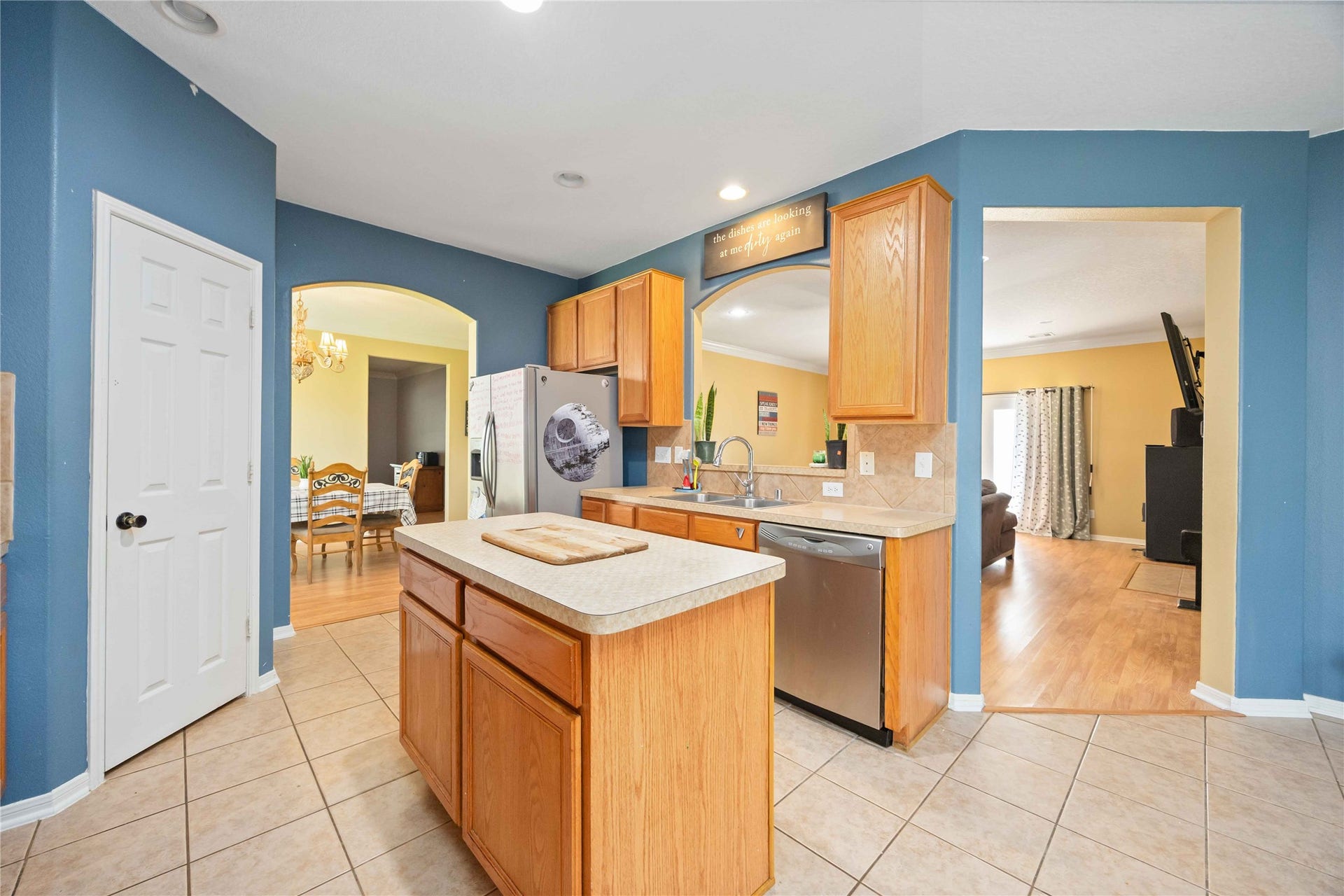Kitchen island, recess lighting and open concept.