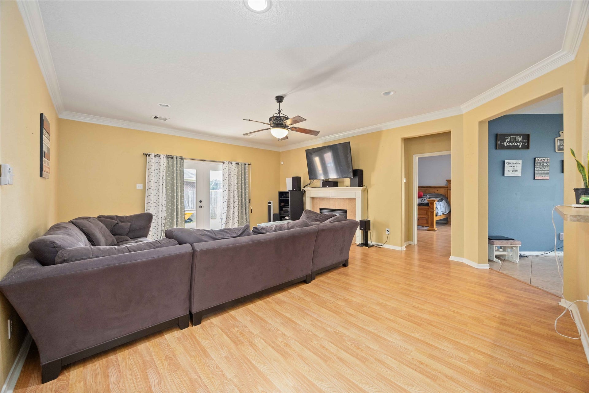 Family room has French door exiting to one of the two patio.