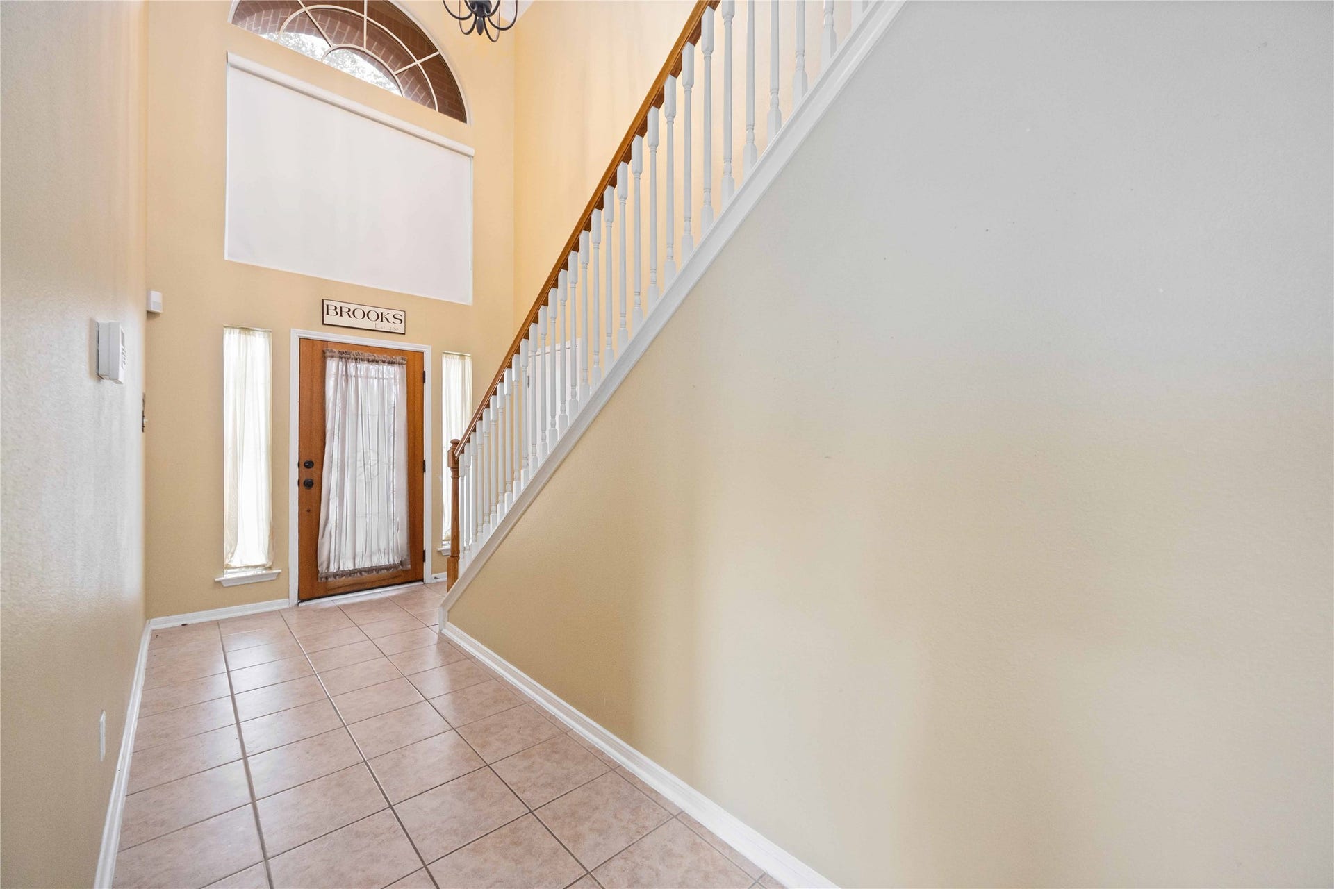 Natural light in the high ceiling foyer.