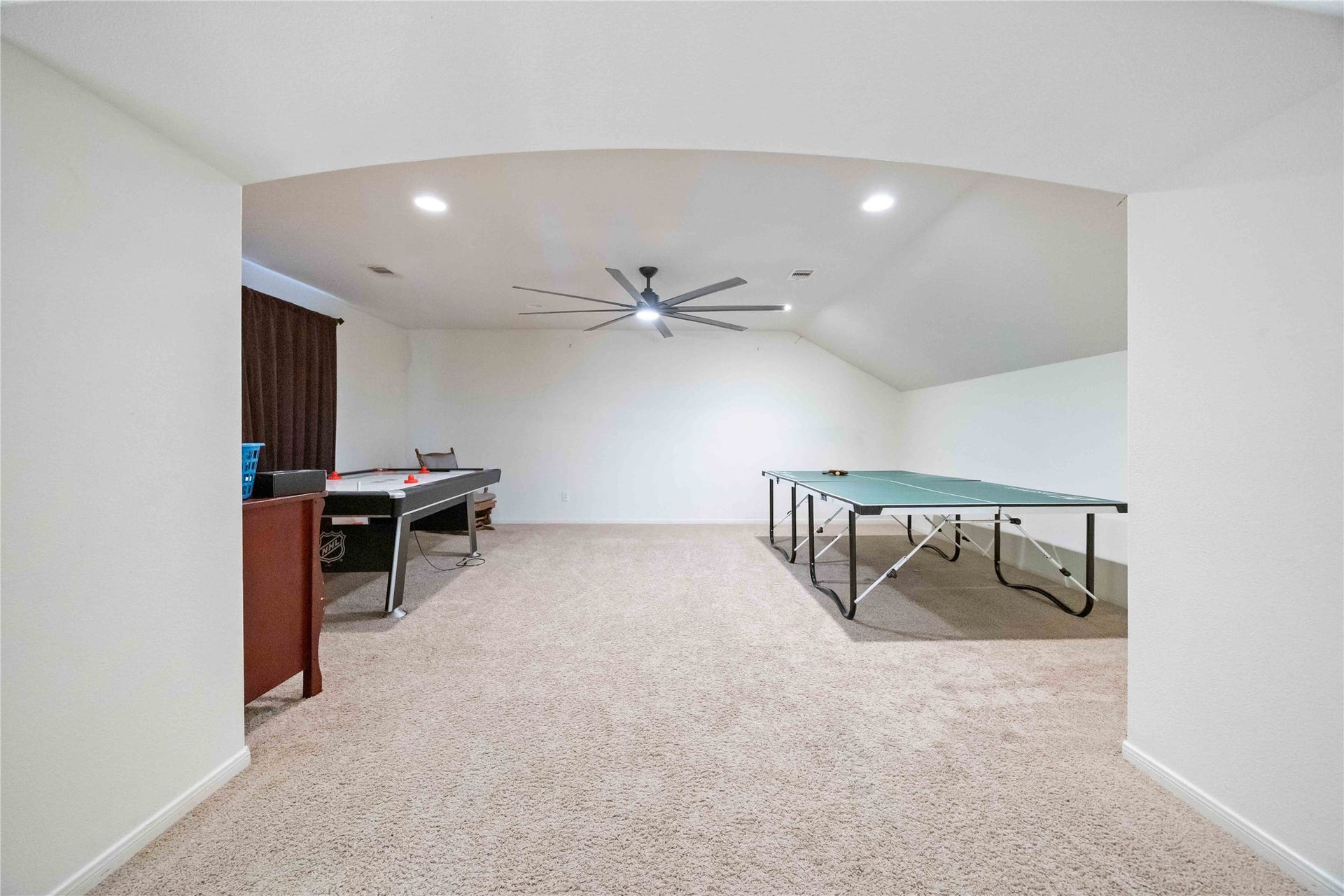 Game room with pre-wired for surround sound system. The room is approximately 20x14.