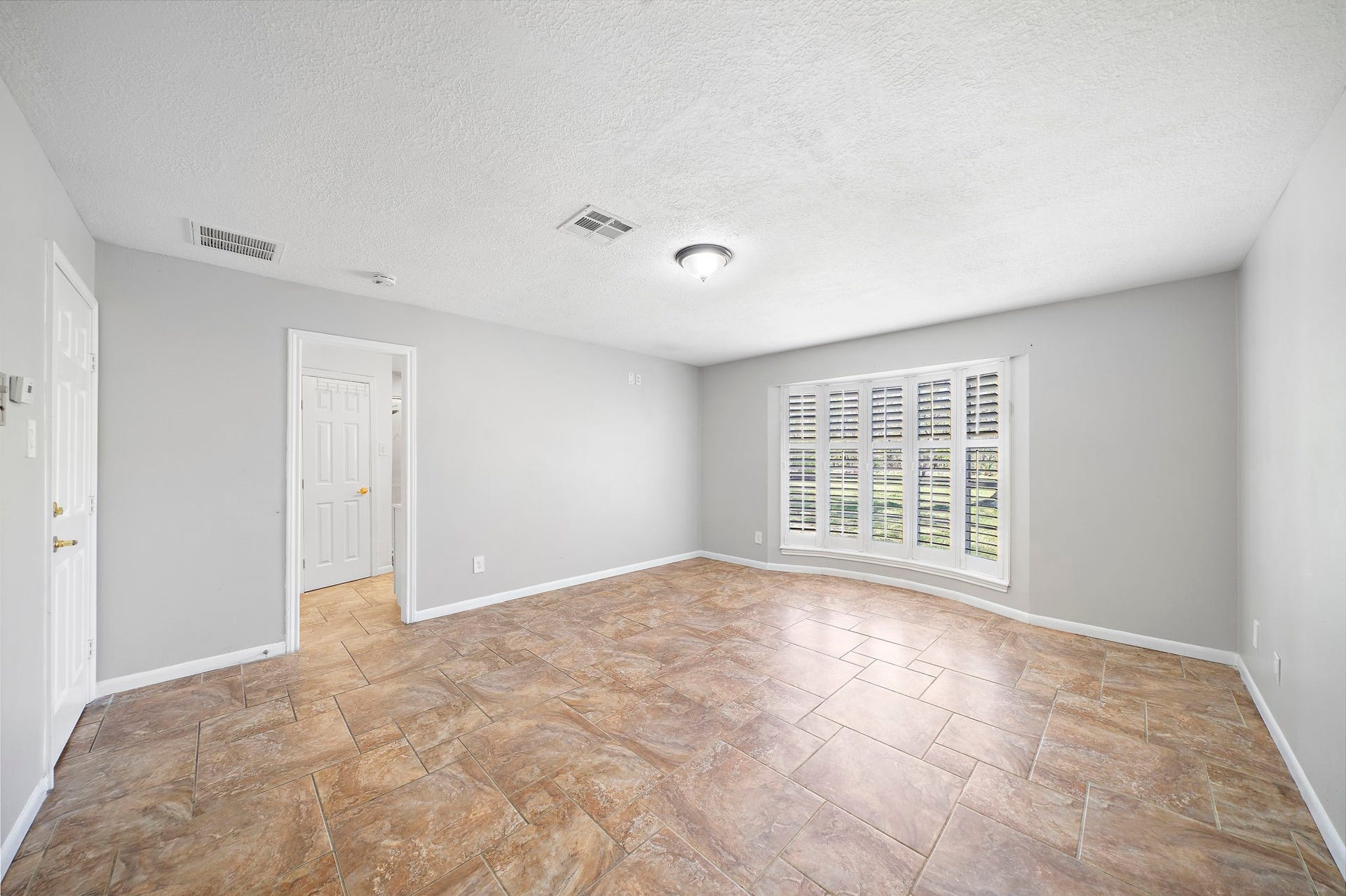 7710 Antoine Drive, Houston, TX 77088 Large Primary bedroom with incredible views to outdoors