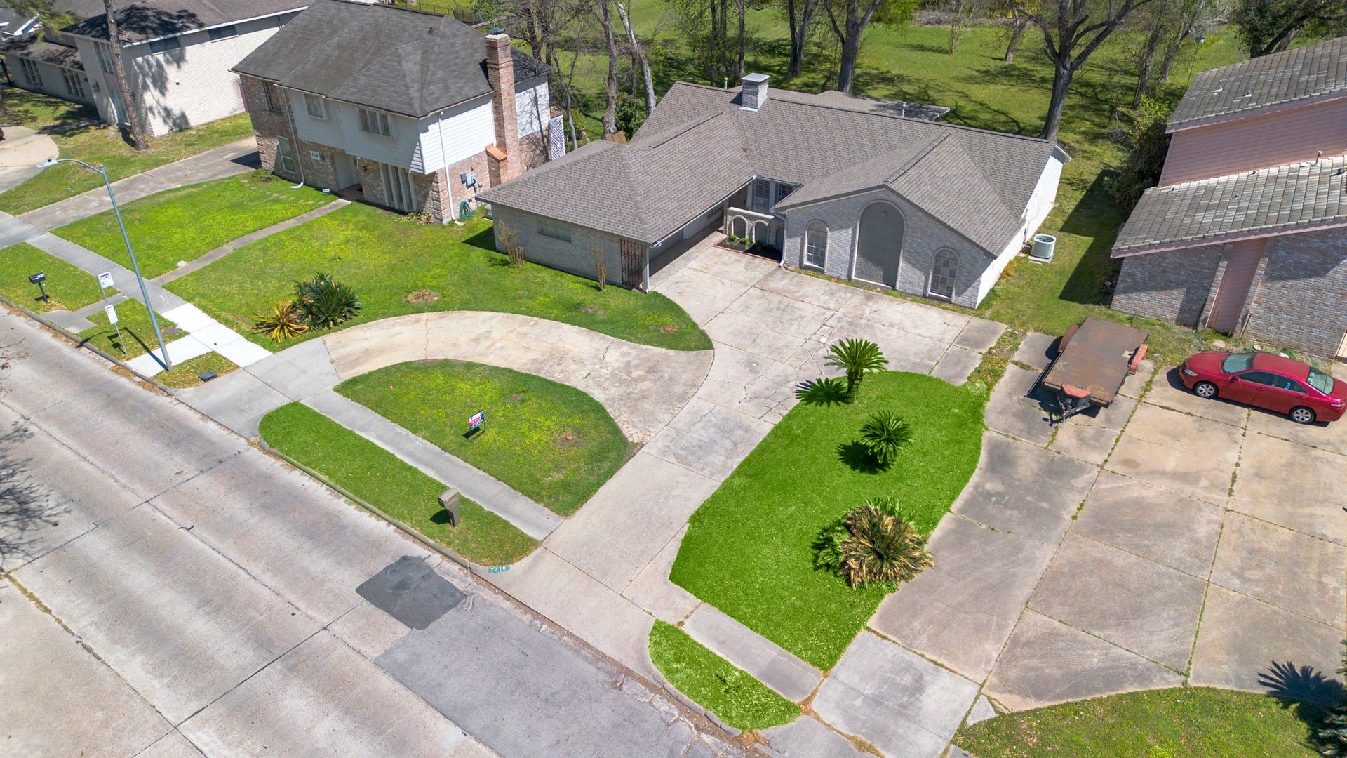 7710 Antoine Drive, Houston, TX 77088 Aerial view of homes shows home large and convent vertical and U shaped driveway