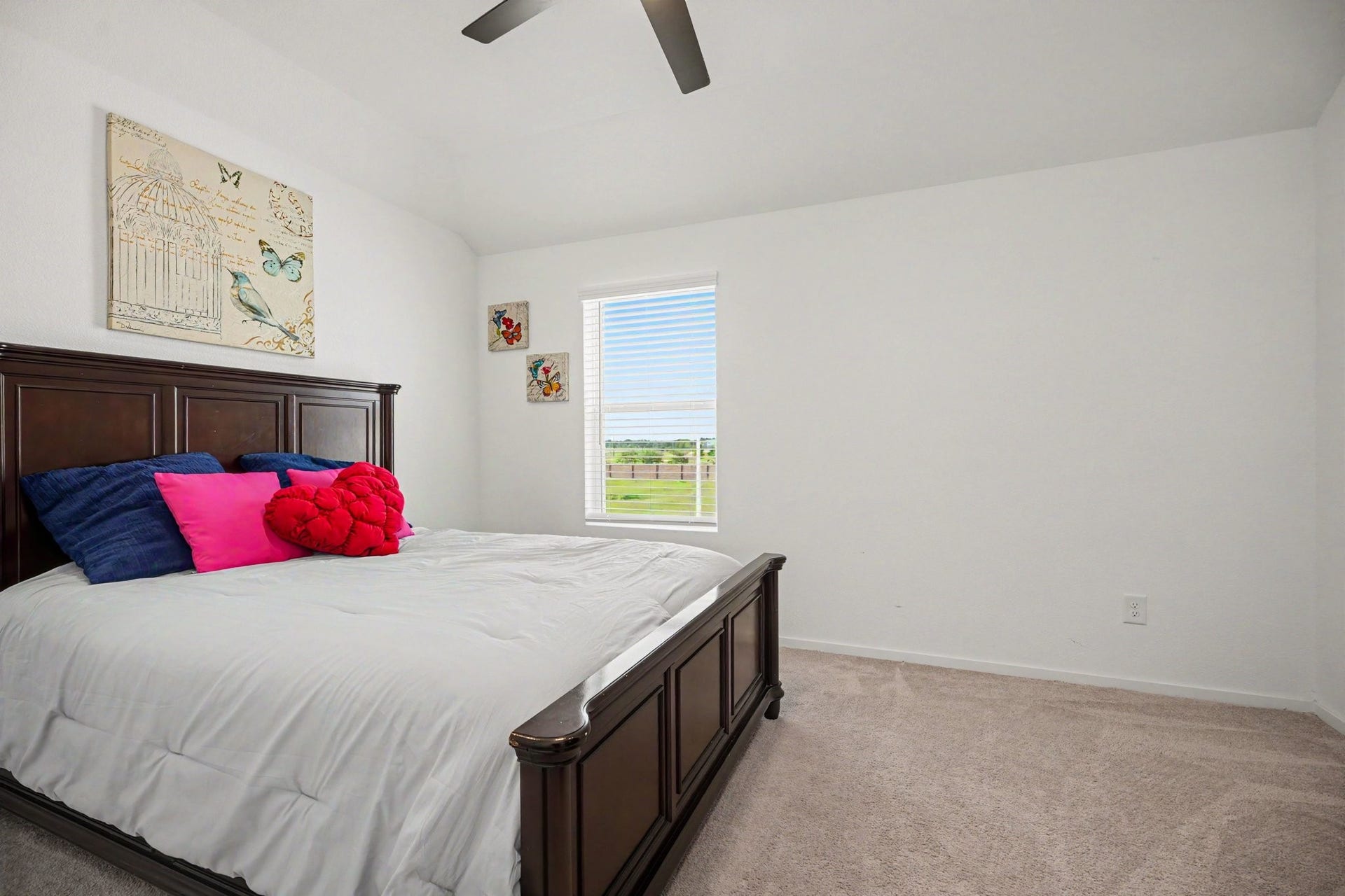 13716 Windward Mist Drive, La Marque, TX 77568 Well-sized secondary bedroom with vaulted ceilings, plush carpeting, and a spacious layout.