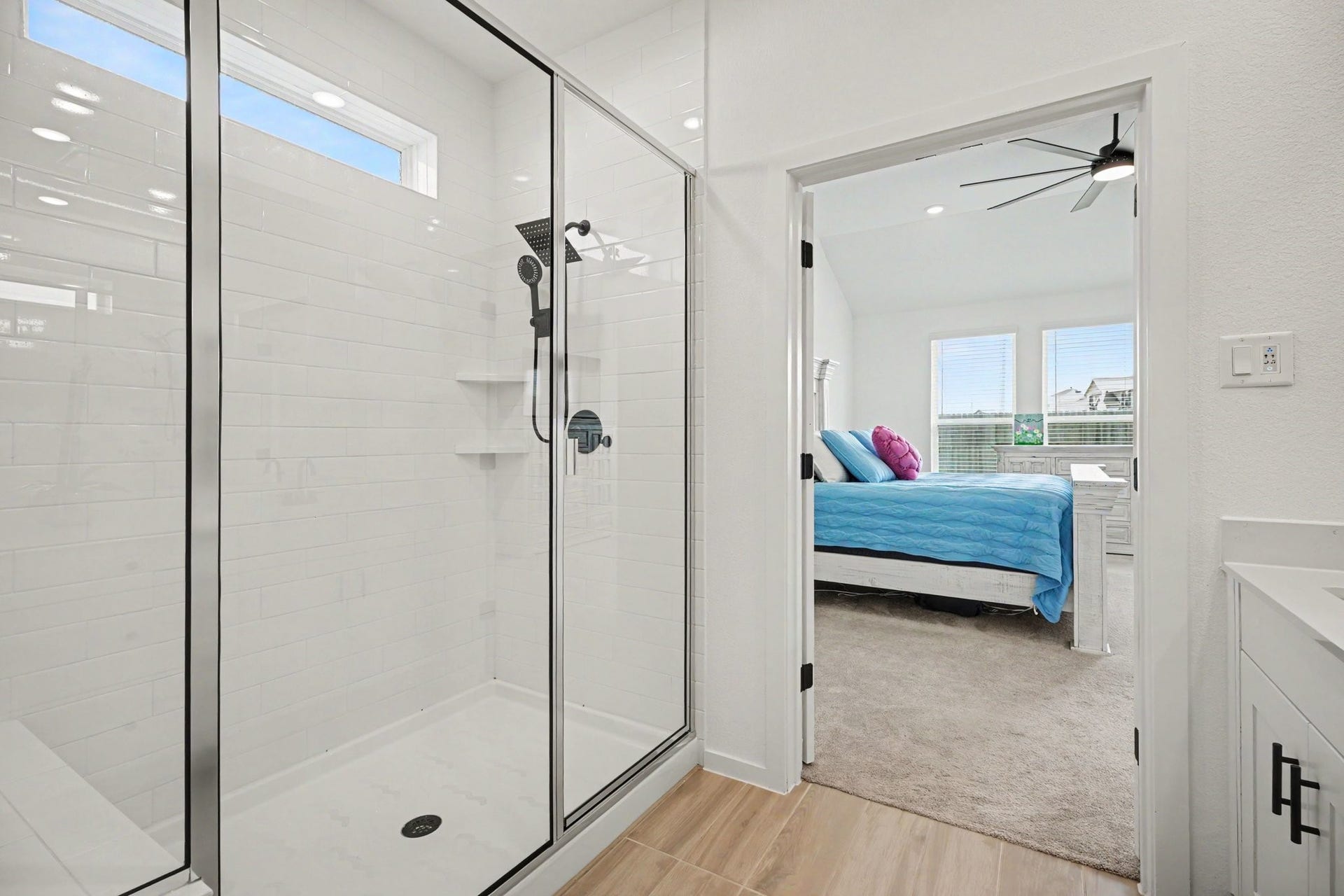 13716 Windward Mist Drive, La Marque, TX 77568 Oversized walk-in shower with frameless glass enclosure, modern fixtures, built-in shelving, and a clean, contemporary design.