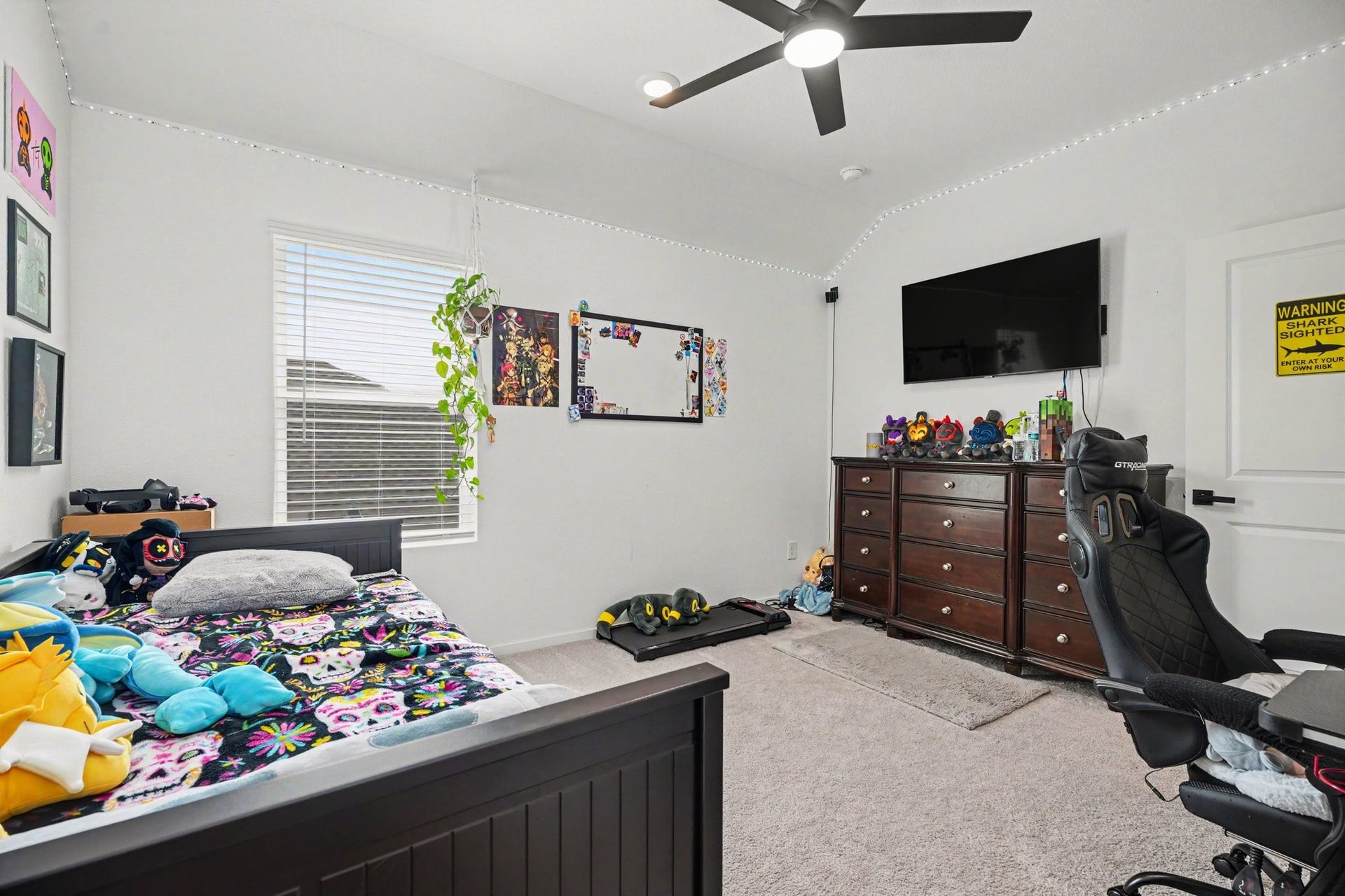 13716 Windward Mist Drive, La Marque, TX 77568 Secondary bedroom with plush carpeting, a large window, and a comfortable layout.