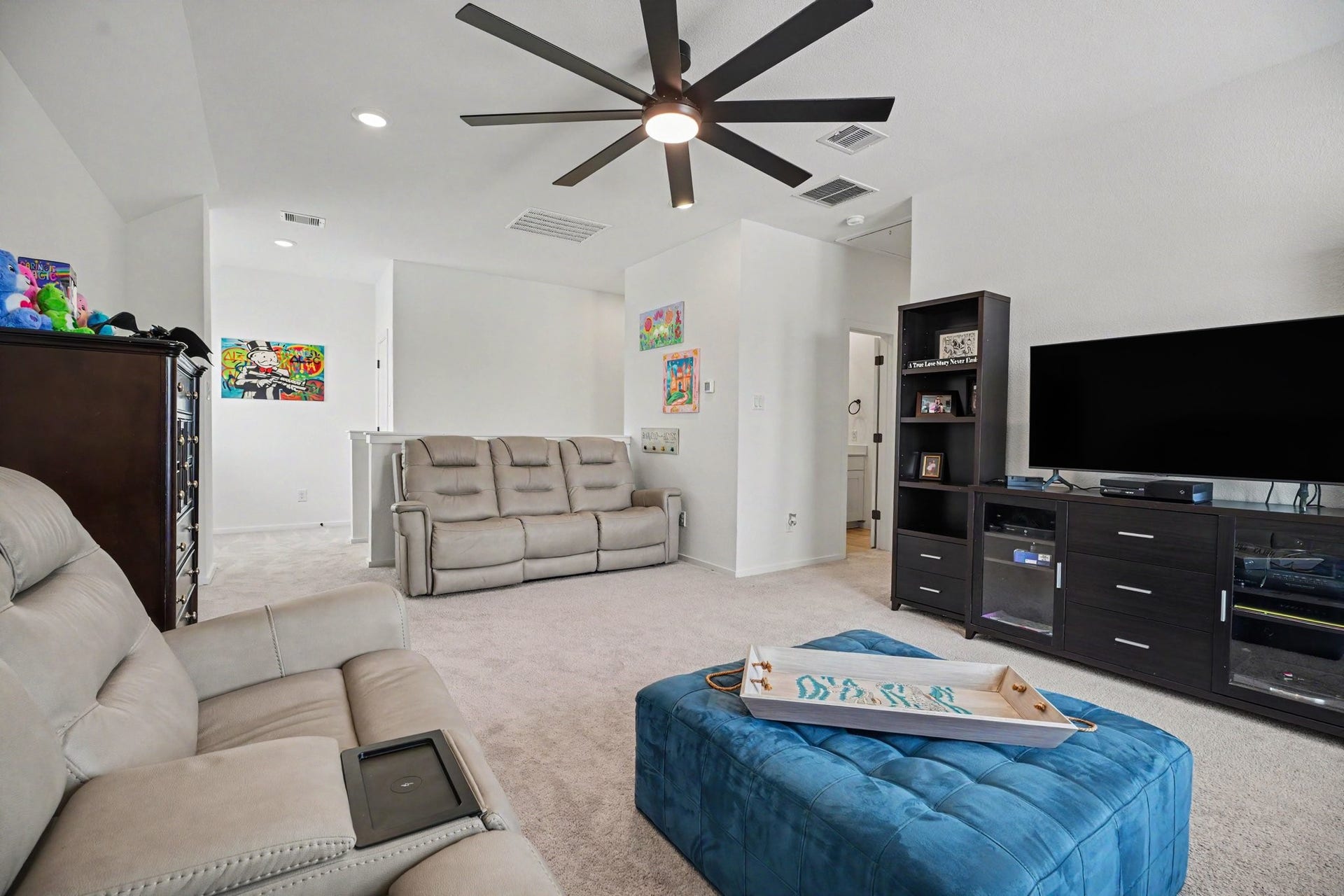 13716 Windward Mist Drive, La Marque, TX 77568 Expansive game room providing a versatile space for media, recreation, hobbies, or a secondary living area.