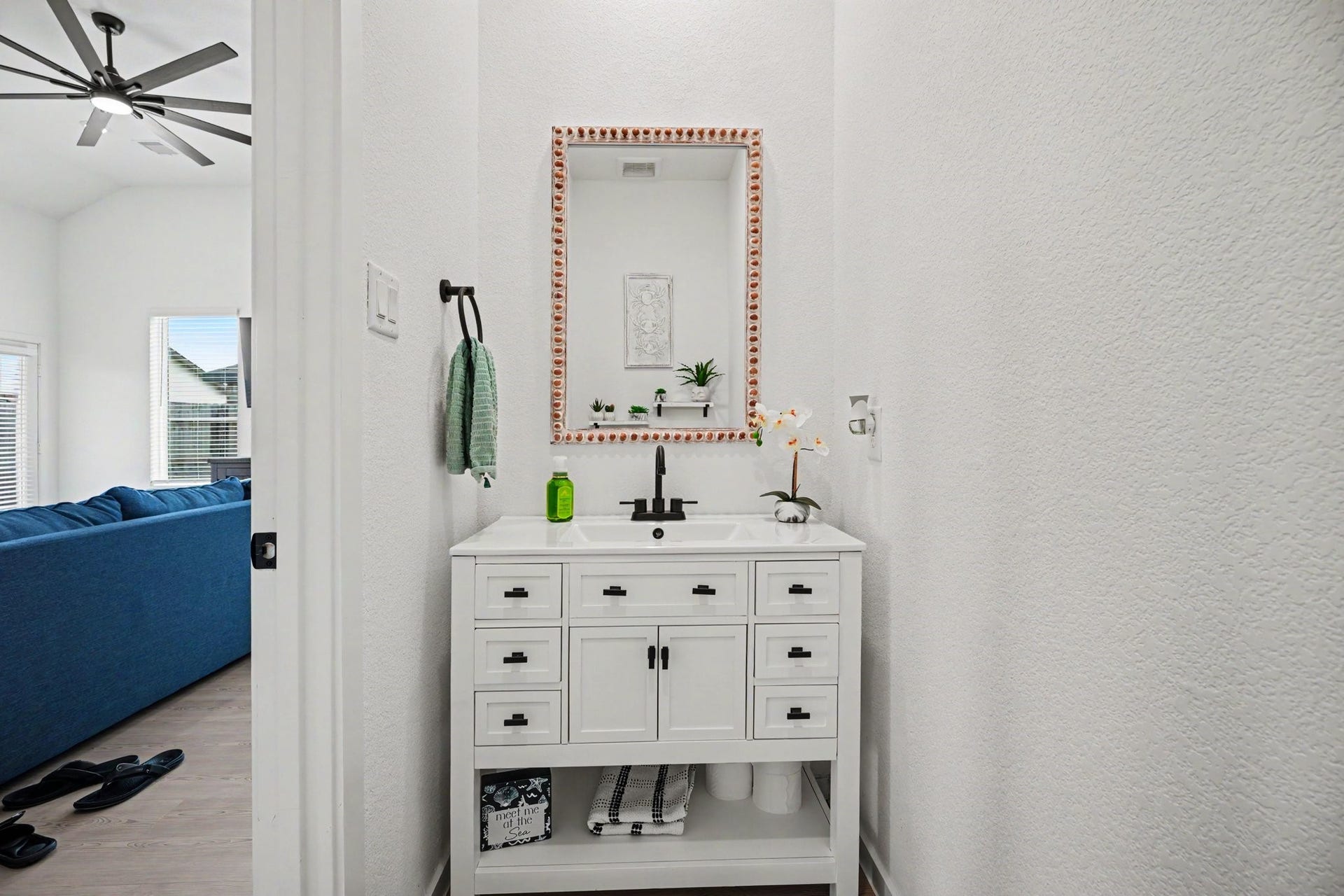 13716 Windward Mist Drive, La Marque, TX 77568 Convenient first-floor half bathroom featuring an updated vanity and modern fixtures.