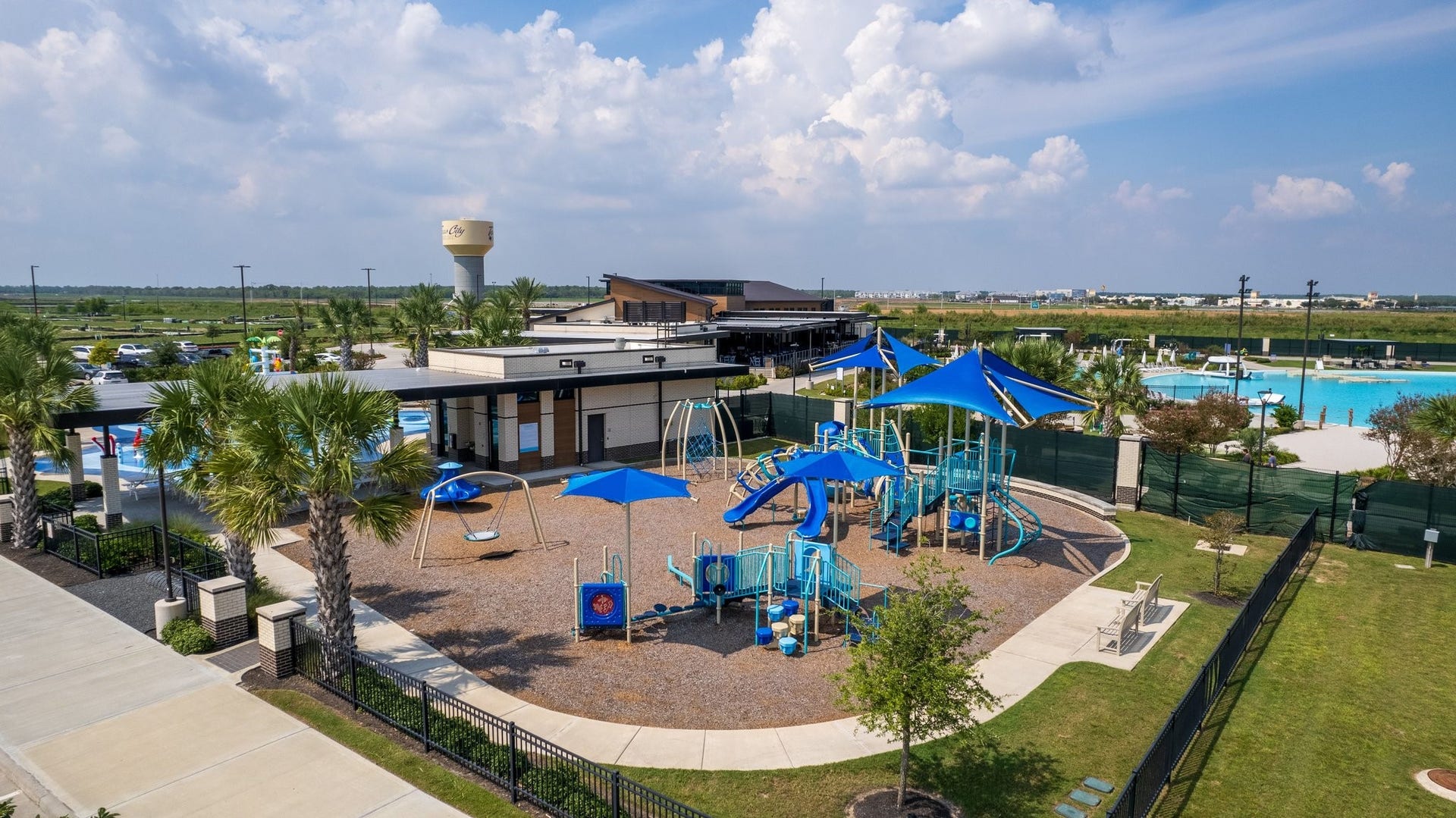 13716 Windward Mist Drive, La Marque, TX 77568 Community playground featuring shaded play structures, swings, and family-friendly outdoor recreation areas.
