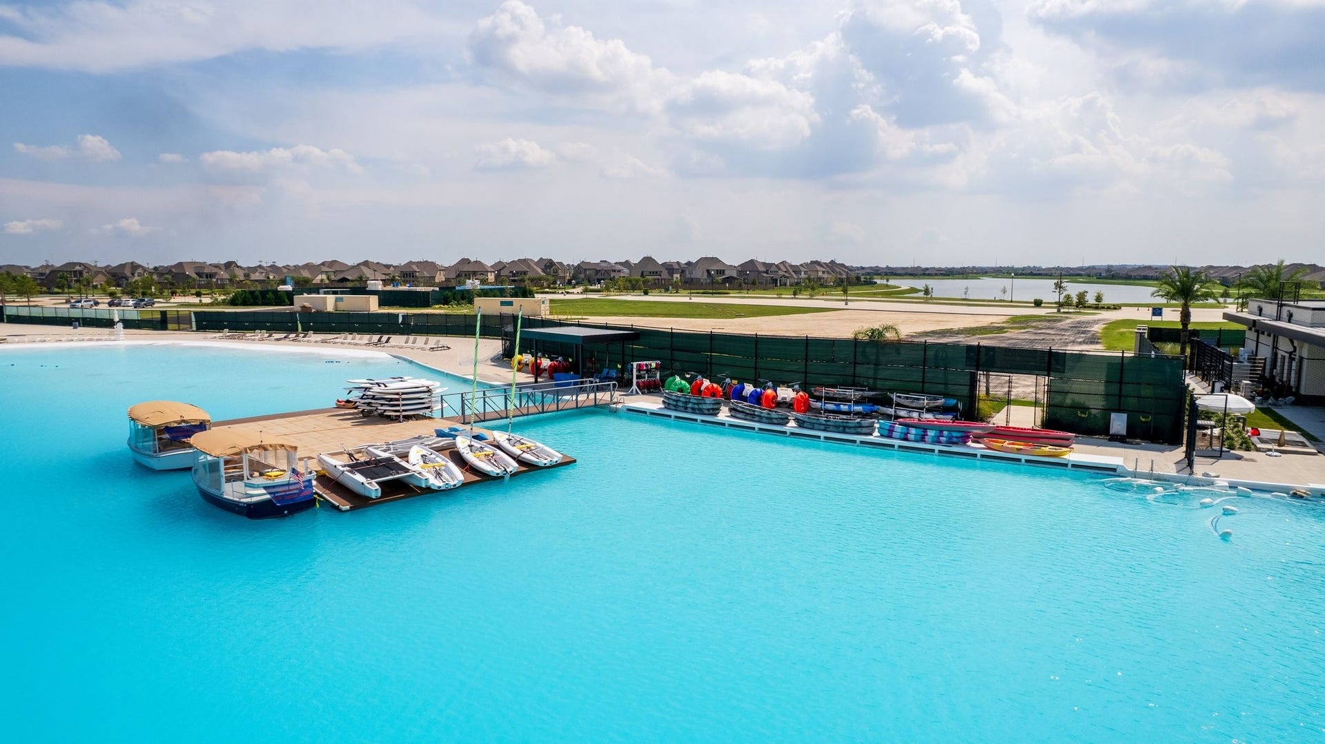 13716 Windward Mist Drive, La Marque, TX 77568 The community lagoon offers opportunities for kayaking, paddleboarding, and enjoying the waterfront lifestyle.