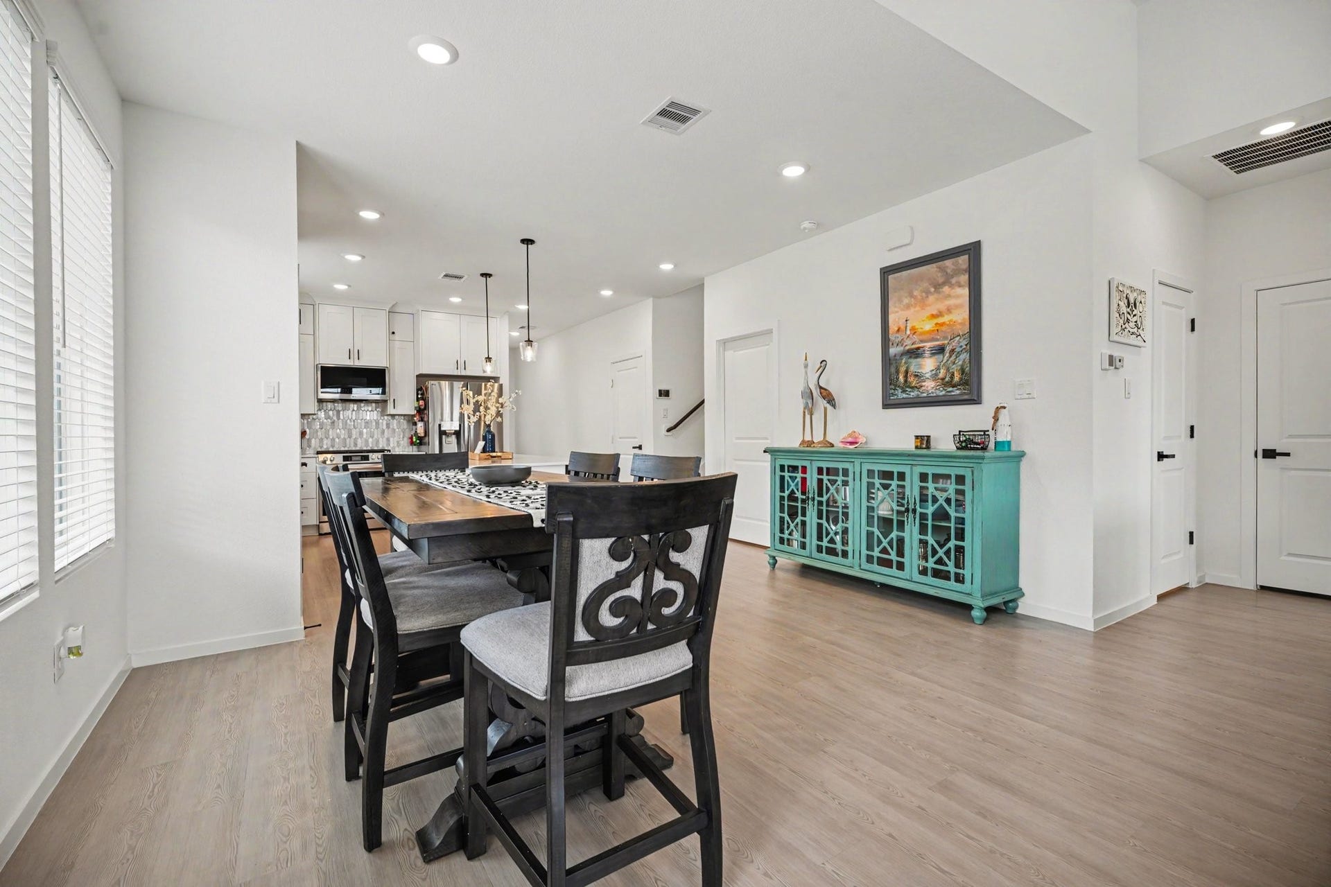 13716 Windward Mist Drive, La Marque, TX 77568 Dining area positioned within the open-concept layout, providing a seamless flow between the kitchen and main living spaces.