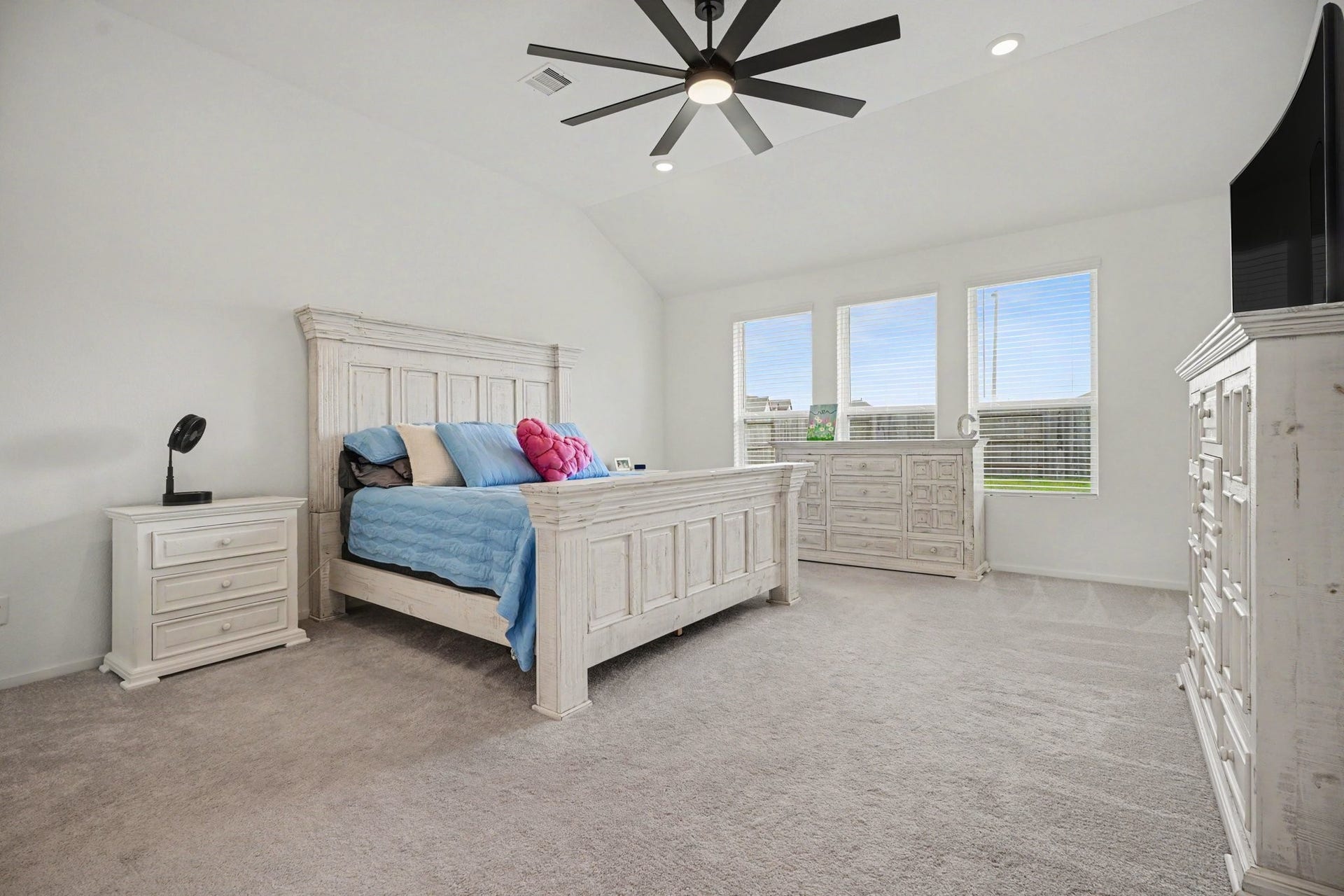 13716 Windward Mist Drive, La Marque, TX 77568 Spacious primary suite featuring high ceilings, generous proportions, and large windows that fill the room with natural light.