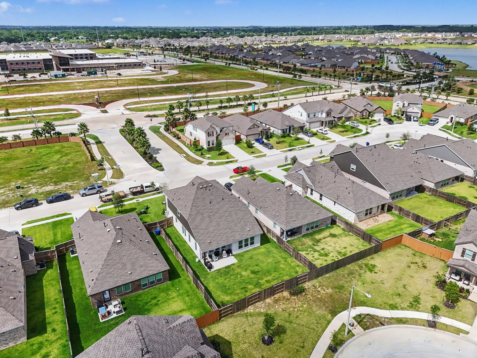 13716 Windward Mist Drive, La Marque, TX 77568 Rear aerial view highlighting the oversized backyard and the home's location within this growing master-planned community.