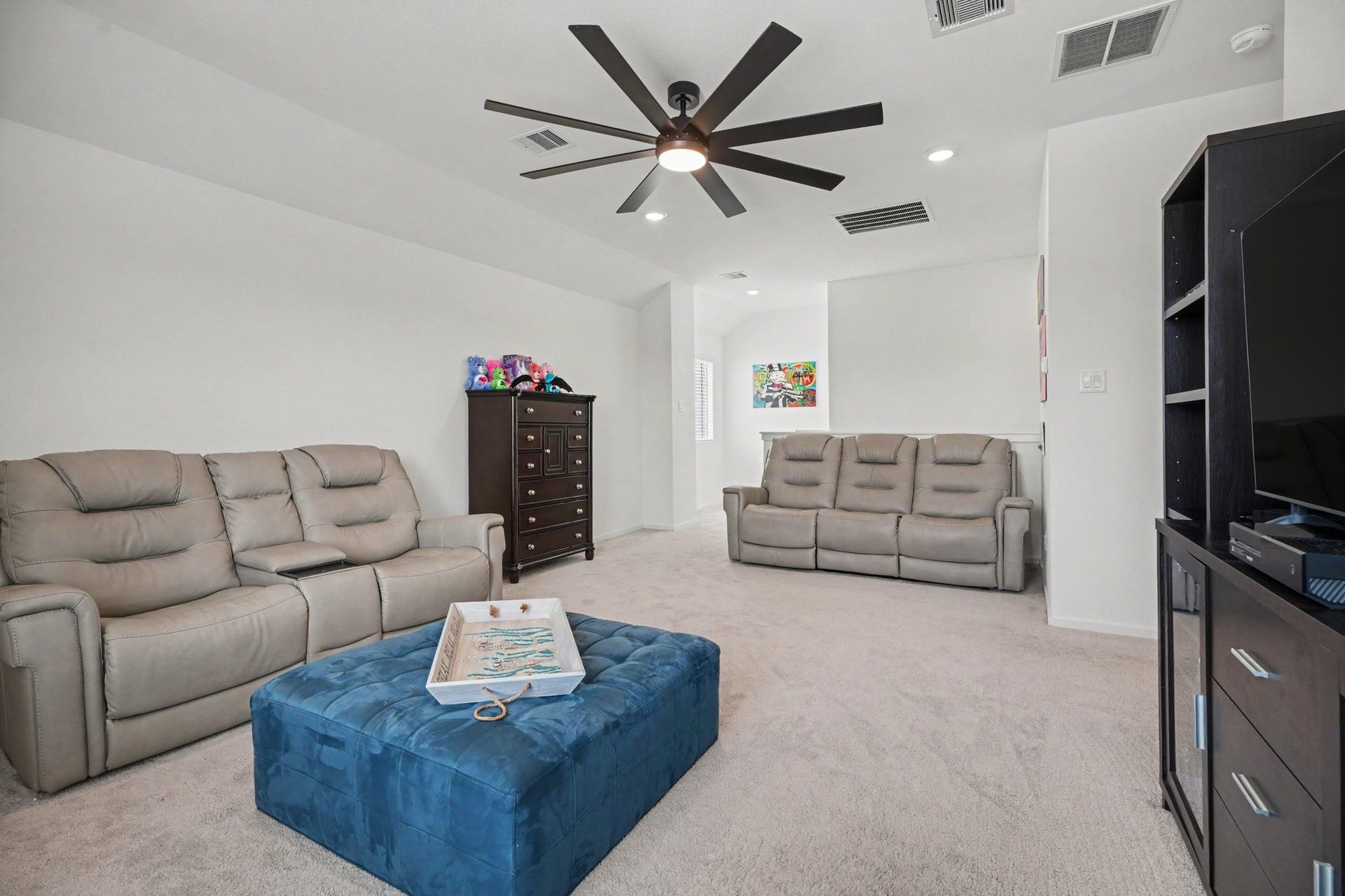 13716 Windward Mist Drive, La Marque, TX 77568 Spacious upstairs game room with vaulted ceilings, recessed lighting, and plenty of room for media, recreation, or gathering space.