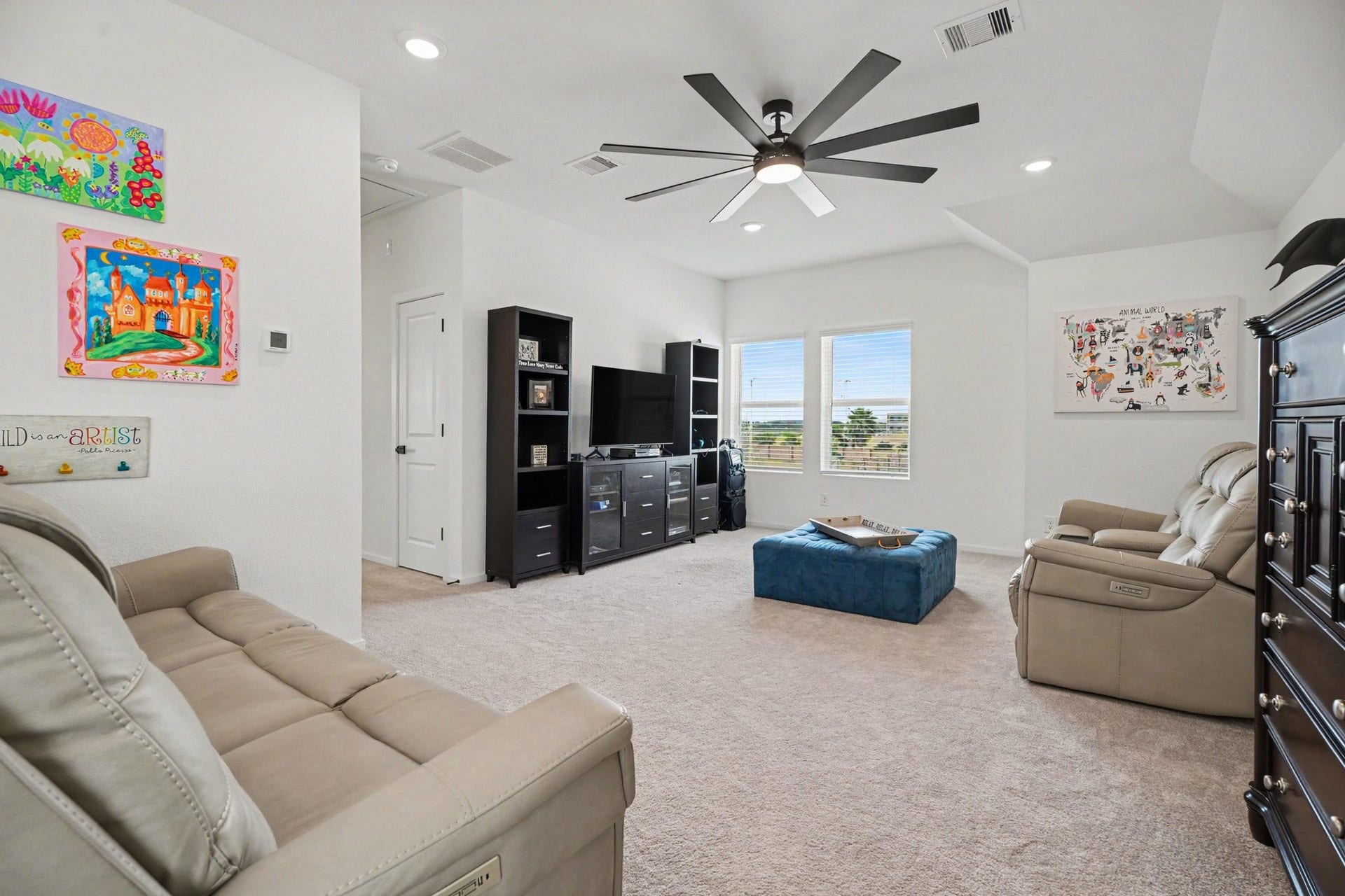 13716 Windward Mist Drive, La Marque, TX 77568 Alternate view of the game room showcasing its generous size, vaulted ceiling, and flexible layout.