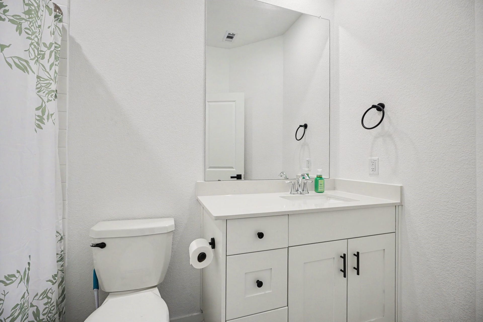 13716 Windward Mist Drive, La Marque, TX 77568 Secondary bathroom featuring a vanity with storage, updated fixtures, and a tub/shower combination.