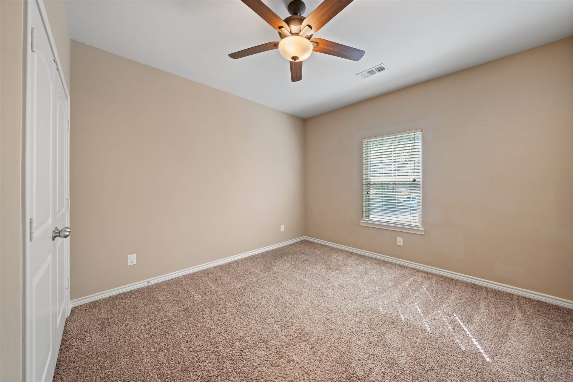 First bedroom. All bedrooms have ceiling fans, and window blinds throughout.