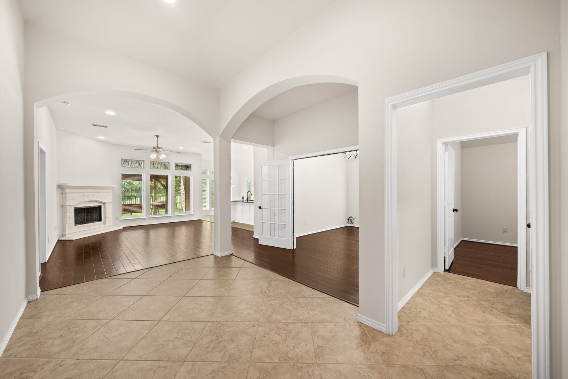 2634 Night Song Drive, Pearland, TX 77584 Open concept living room with abundant natural light and a cozy fireplace.