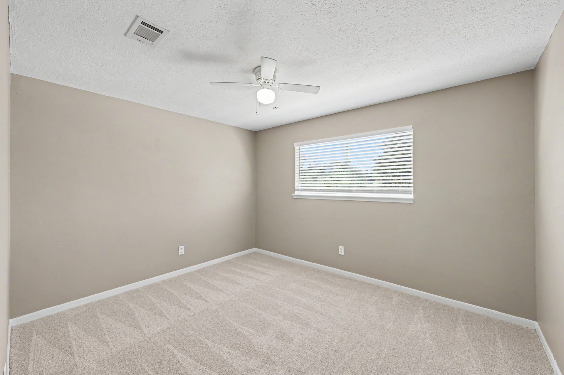 A bright and inviting bedroom with endless possibilities!